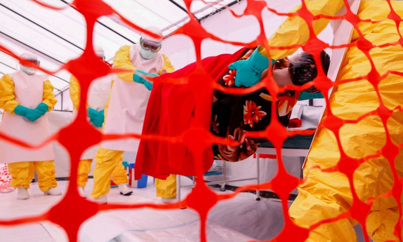 Health workers wearing Personal Protective Equipment (PPE) attend a training by Medecins Sans Frontieres (MSF) for personnel preparing to reinforce regional Ebola response capacity in the Democratic Republic of Congo amid an outbreak of the Bundibugyo strain, at an Ebola simulation treatment center set up by MSF in Kajiado County near Nairobi, Kenya, August 5, 2026.
