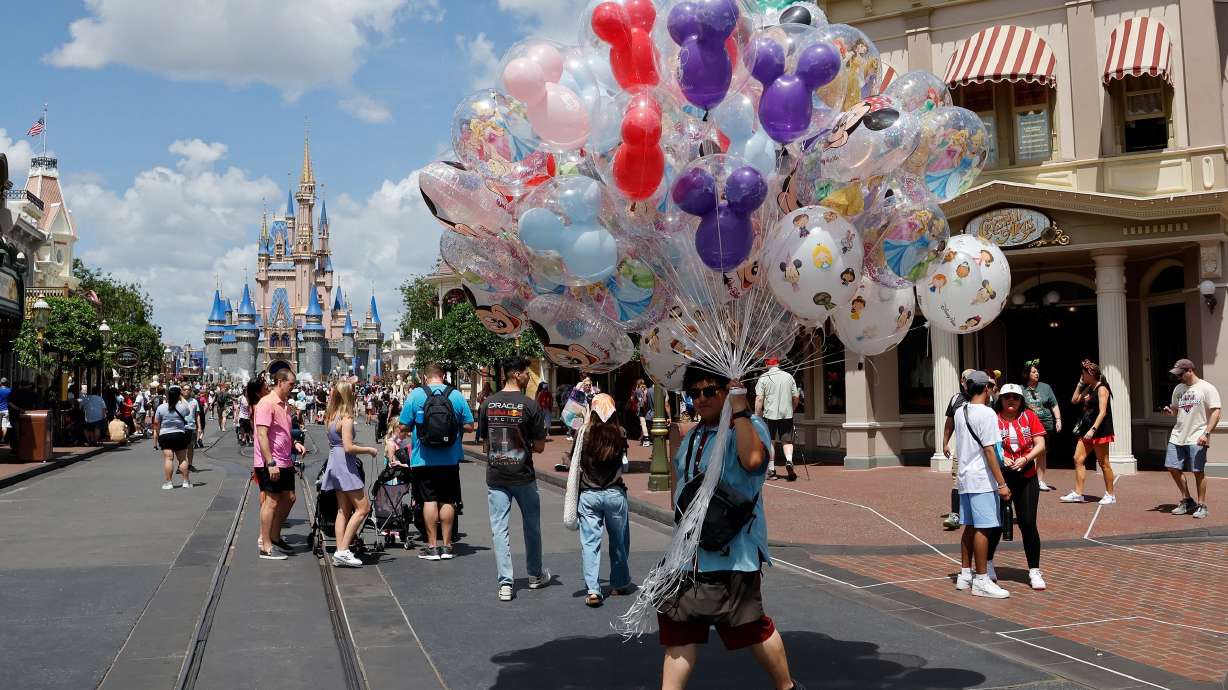 A vendor sells balloons at Walt Disney World on April 3, 2025, in Orlando, Florida.