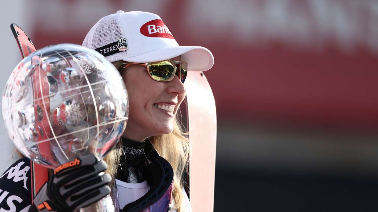 FILE - United States' Mikaela Shiffrin celebrates winning the women's overall World Cup skiing title, at the Lillehammer World Cup Finals, in Hafjell, Norway, Wednesday, March 25, 2026.