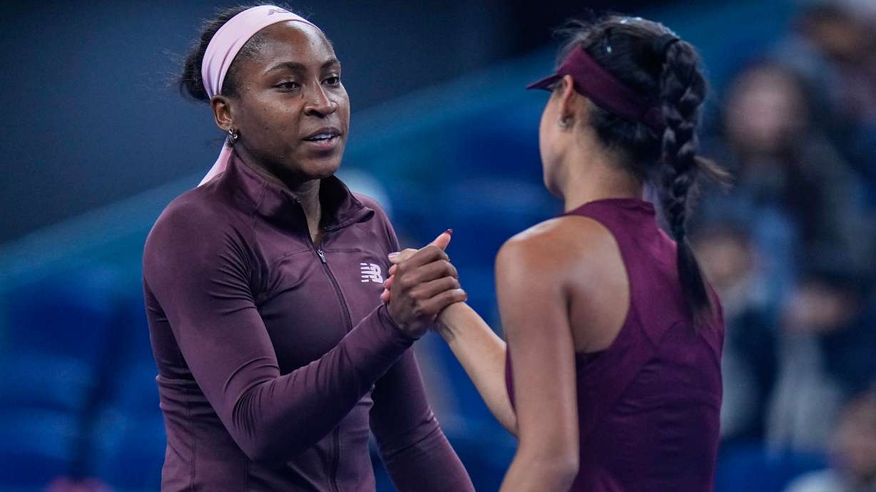 Coco Gauff of the United States, shake hands with Xinran Sun of China, after winning the third round of the women's singles match at the China Open tennis tournament in Beijing, Monday, Oct. 5, 2026.