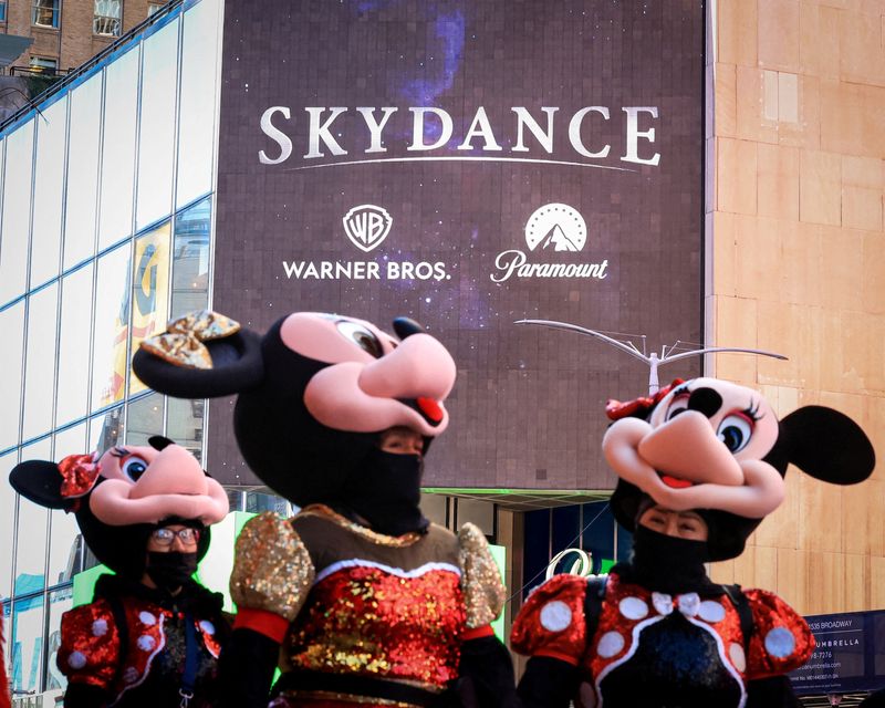 A billboard displaying the logos of Skydance, Warner Bros. and Paramount on the Paramount Global offices in Times Square after the merger of Paramount Skydance and Warner Bros. Discovery, in New York City, Oct. 6.