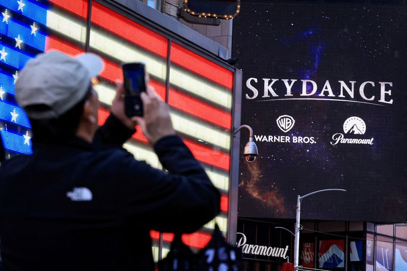 A billboard displaying the logos of Skydance, Warner Bros. and Paramount on the Paramount Global offices in Times Square after the merger of Paramount Skydance and Warner Bros. Discovery, in New York City, Oct. 6.