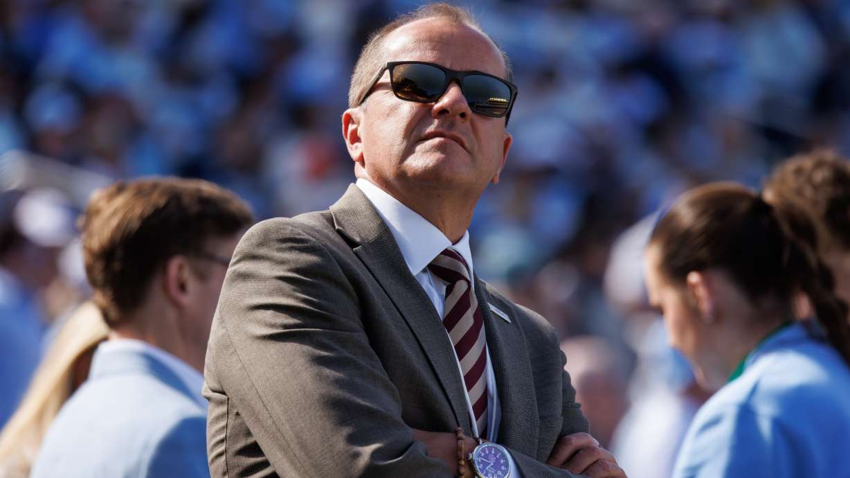 FILE - ACC Commissioner Jim Phillips walks the sideline during an NCAA college football game between North Carolina and Virginia in Chapel Hill, N.C., Oct. 25, 2025.