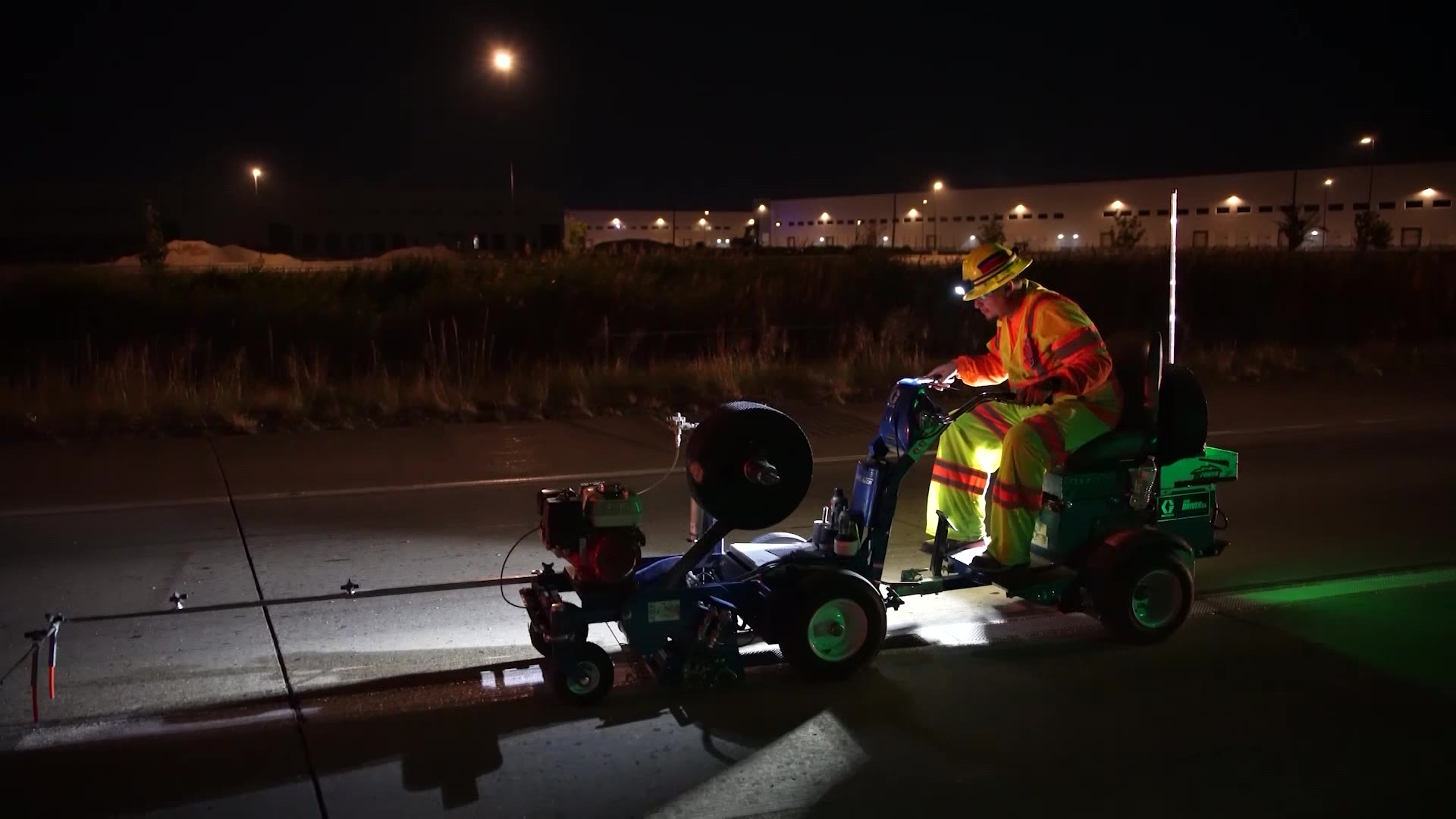 UDOT road crews peform "zebra striping" on Bangerter Highway.