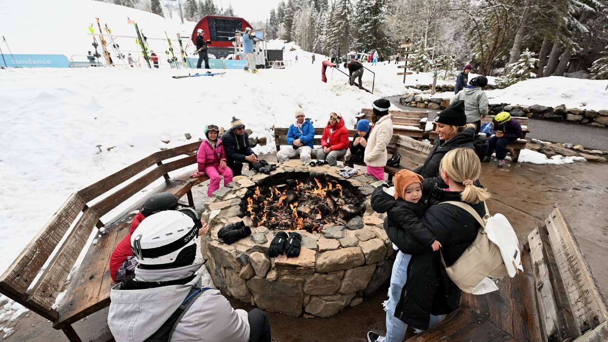 Skiers and snowboarders enjoy part of their day sitting next to a fire at Sundance Mountain Resort in Provo Canyon on March 13, 2024.