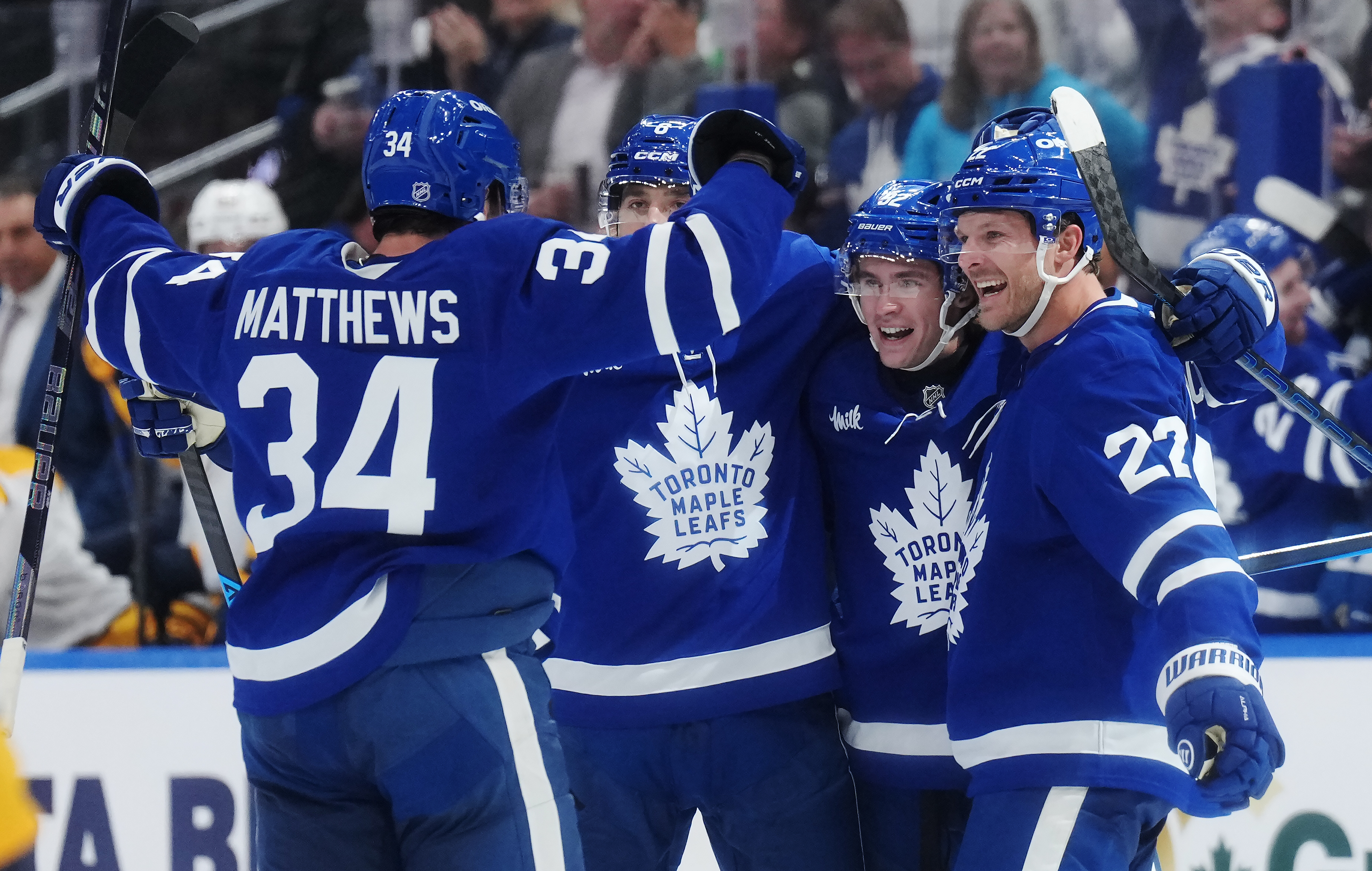 Toronto Maple Leafs' Gavin McKenna (second right) celebrates his goal against the Nashville Predators with Auston Matthews, left to right, Chris Tanev and Jake McCabe during the second period of an NHL hockey game in Toronto, Tuesday, Oct. 6, 2026. 