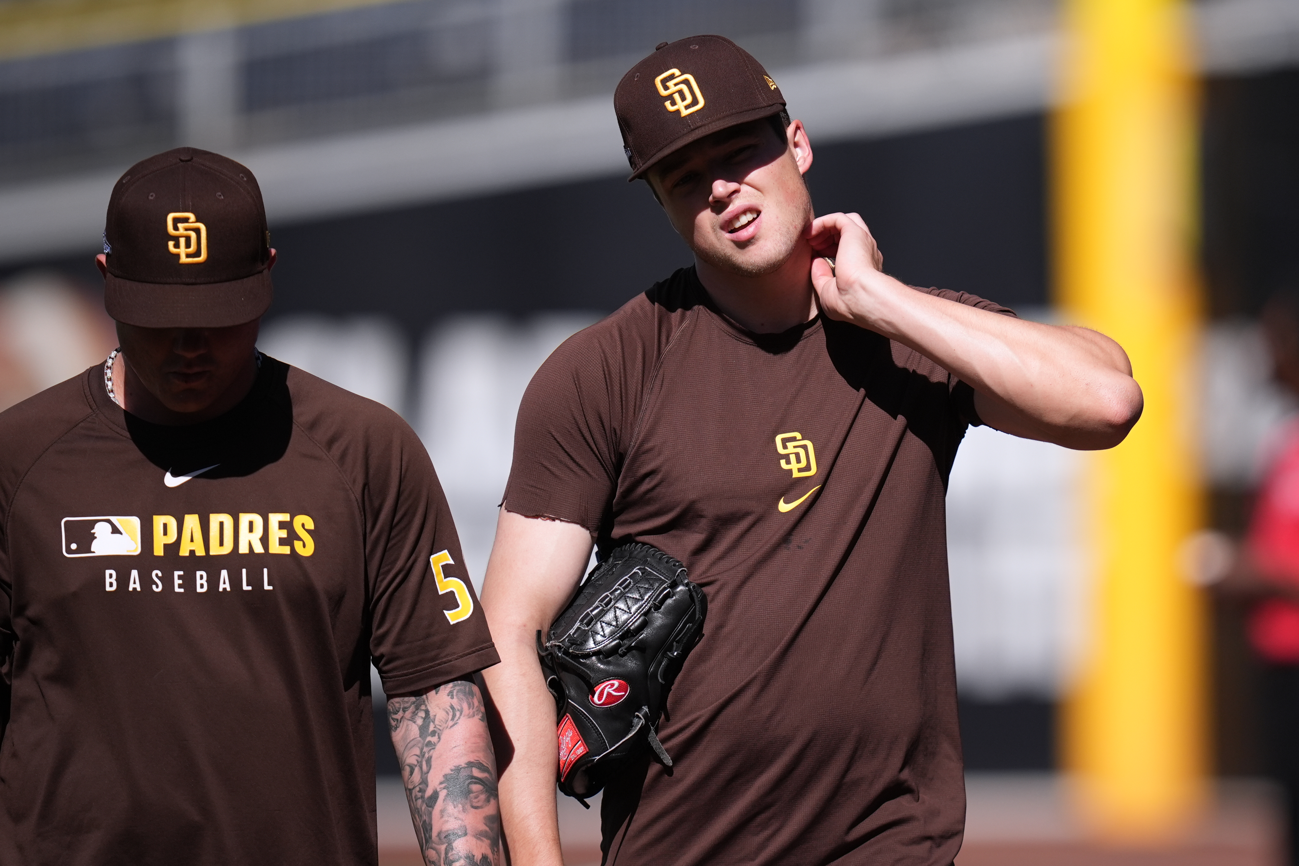 San Diego Padres pitcher Mason Miller, right, walks with pitcher Adrian Morejon during training a day before Game 3 of a National League Division Series baseball game against the Milwaukee Brewers Monday, Oct. 5, 2026, in San Diego. 
