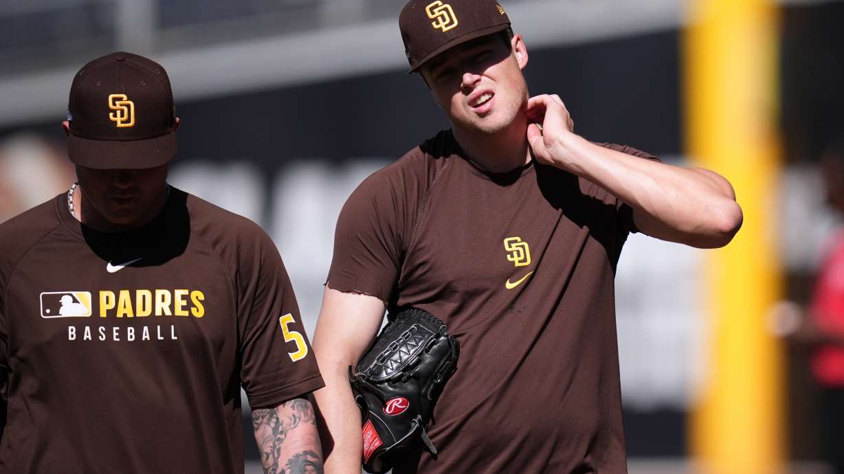 San Diego Padres pitcher Mason Miller, right, walks with pitcher Adrian Morejon during training a day before Game 3 of a National League Division Series baseball game against the Milwaukee Brewers Monday, Oct. 5, 2026, in San Diego.