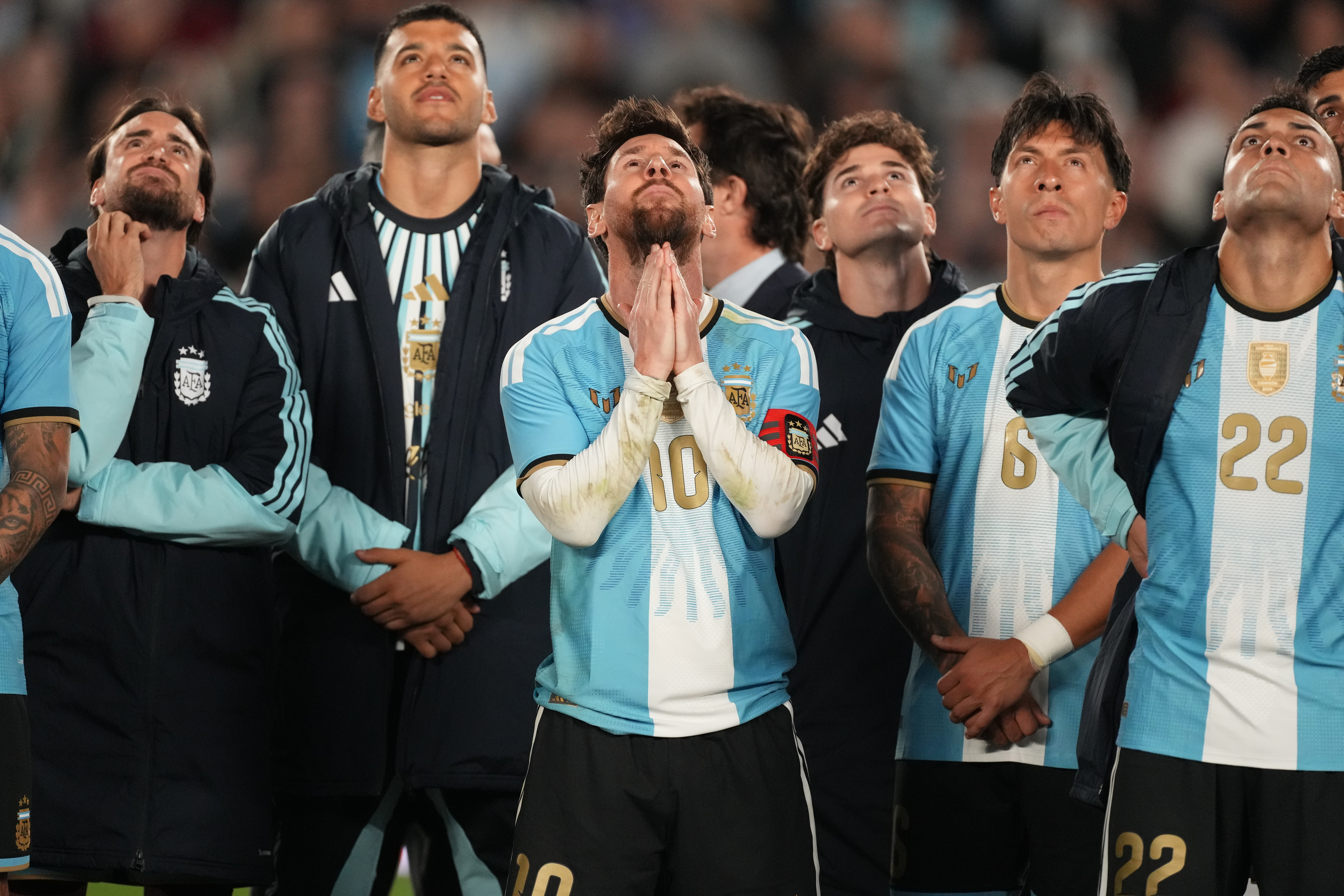 Argentina's Lionel Messi and teammates watch a drone show at the end of his final match for the national team, a soccer friendly against Benin, in Buenos Aires, Argentina, Tuesday, Oct.6, 2026. 