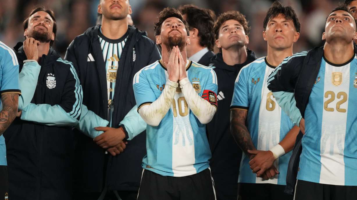 Argentina's Lionel Messi and teammates watch a drone show at the end of his final match for the national team, a soccer friendly against Benin, in Buenos Aires, Argentina, Tuesday, Oct.6, 2026.