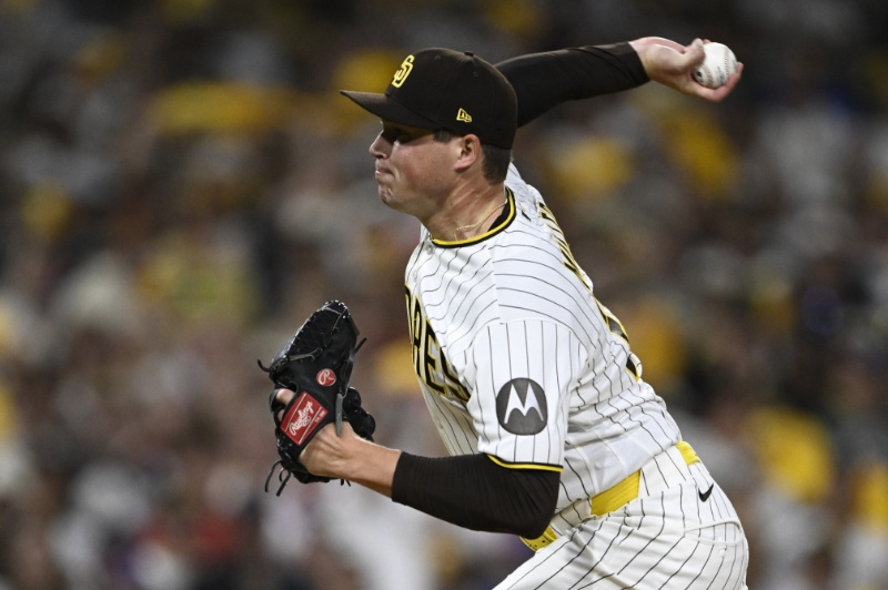 Sep 30, 2026; San Diego, California, USA;  San Diego Padres pitcher Mason Miller (22) delivers a pitch in the ninth inning against the Chicago Cubs during game two of the Wildcard round for the 2026 MLB Playoffs at Petco Park.