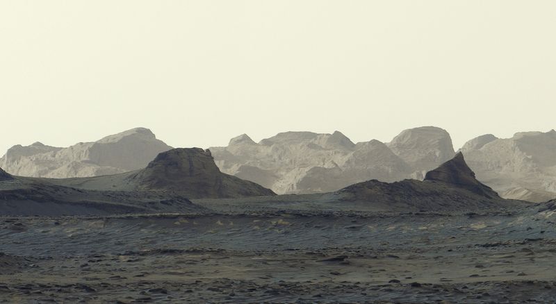A view of the Martian surface taken by NASA's Curiosity on August 11, 2026, showing wind-carved crags called yardangs on Mount Sharp, which rises from Gale Crater near the planet's equator. The photograph is a zoomed-in crop of a broader panorama captured by the rover. NASA/JPL-Caltech/MSSS/Handout via REUTERS
