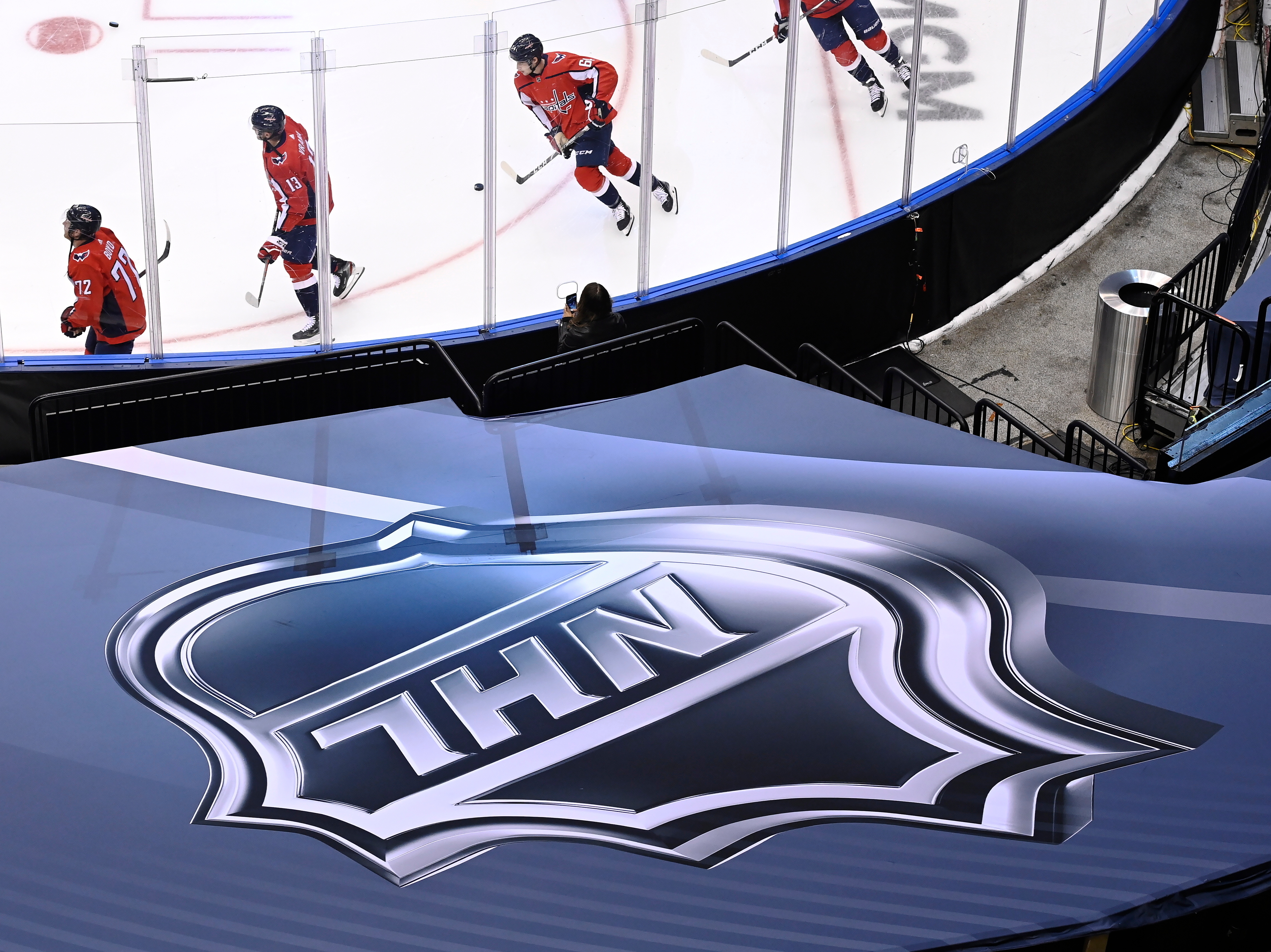 FILE - An NHL logo is displayed on Aug. 14, 2020, prior to the NHL Eastern Conference Stanley Cup playoff hockey game in Toronto. 