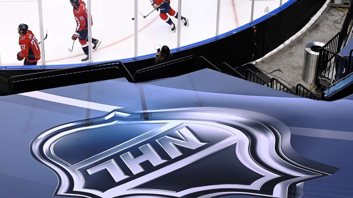 FILE - An NHL logo is displayed on Aug. 14, 2020, prior to the NHL Eastern Conference Stanley Cup playoff hockey game in Toronto.