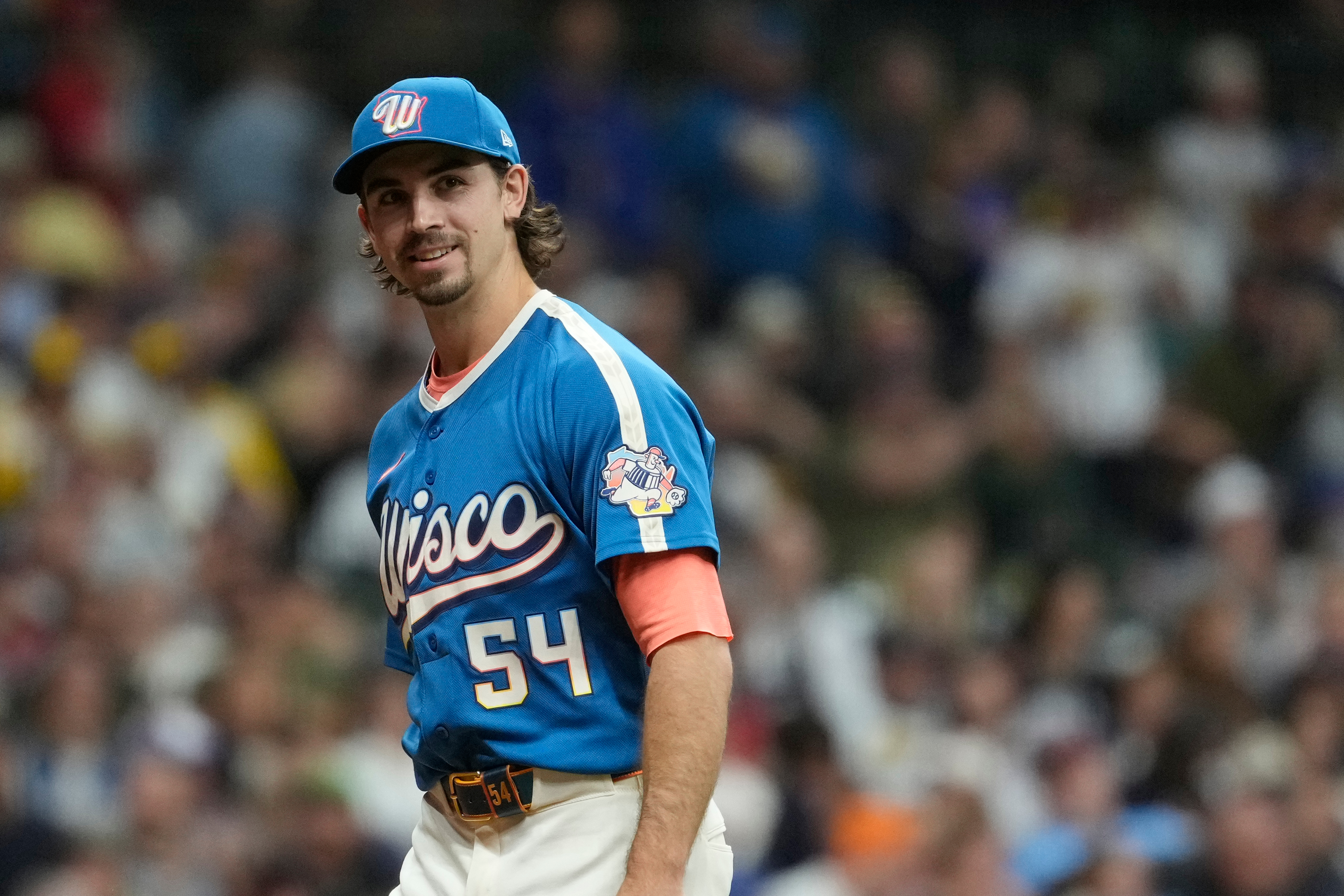 Milwaukee Brewers' Robert Gasser smiles as he walks to the dugout during the second inning of a baseball game against the St. Louis Cardinals, Friday, Sept. 25, 2026, in Milwaukee. 