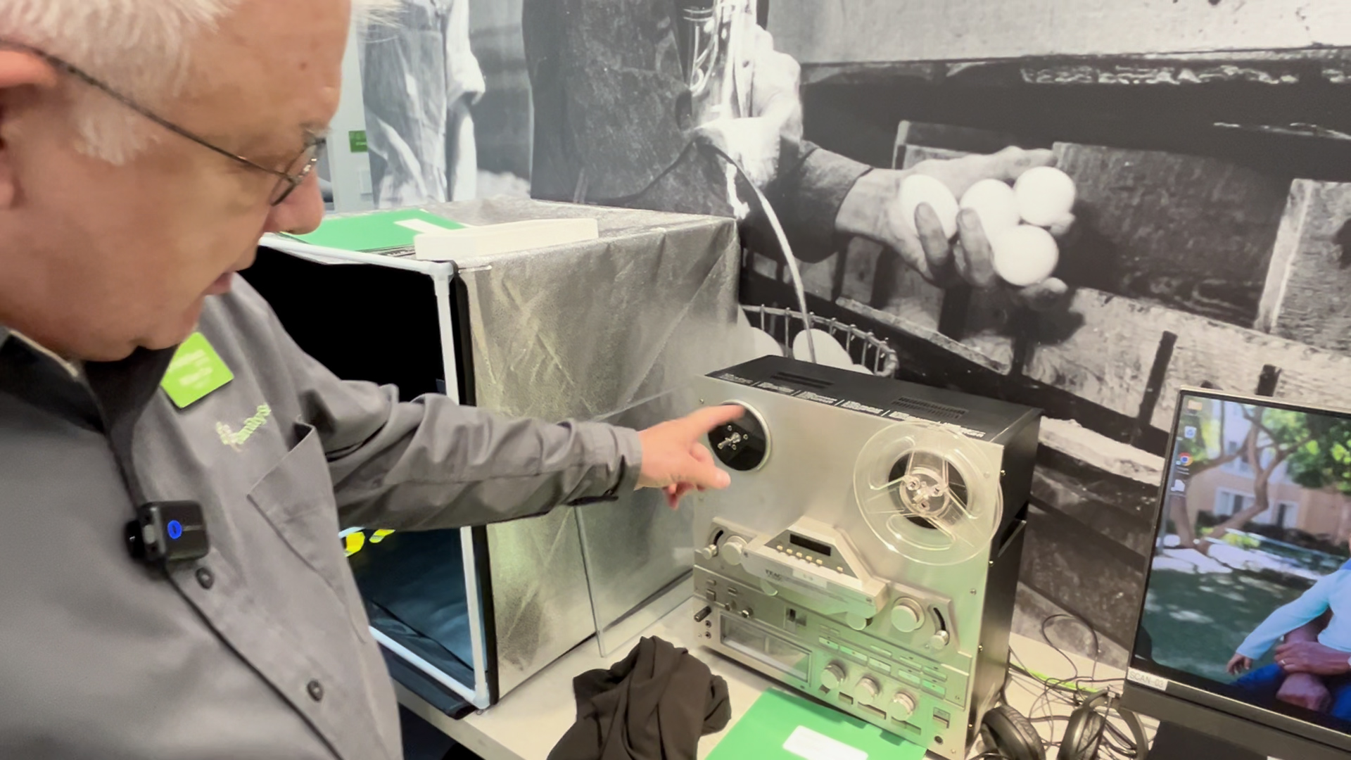 Coordinator Bill Cox shows some of the equipment used to digitize and modernize historical records and photos, including this reel-to-reel tape machine.