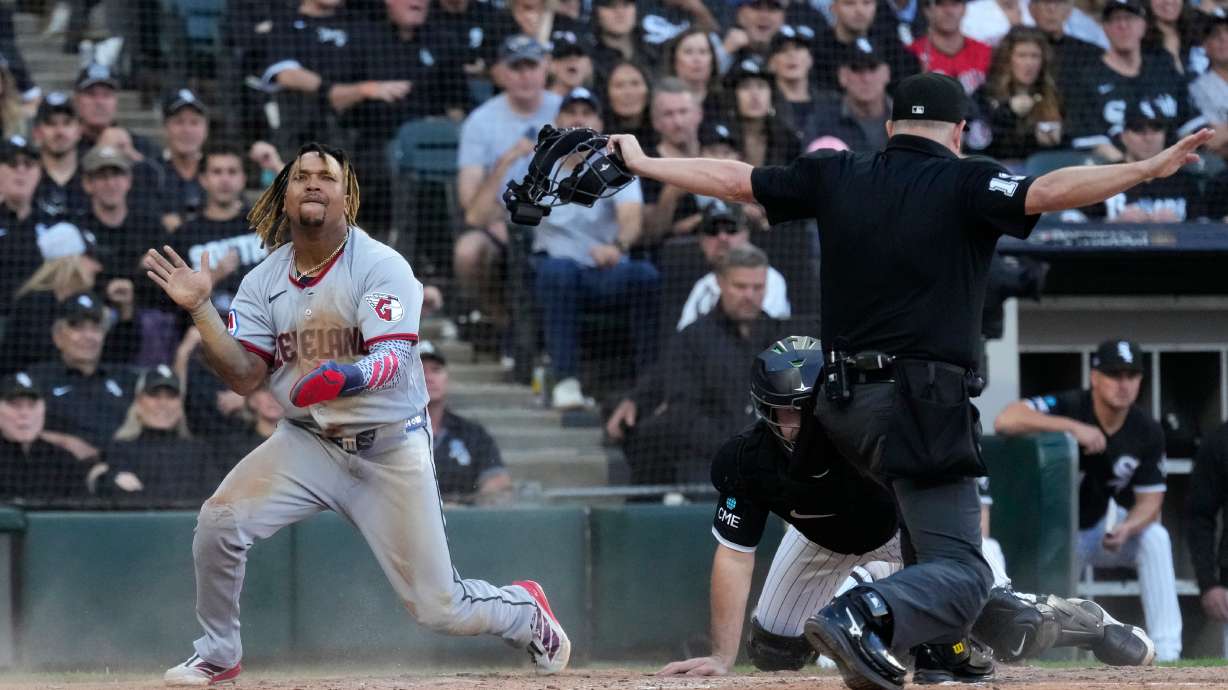 Cleveland Guardians' José Ramírez, left, celebrates after scoring on a fielder's choice by Chase DeLauter during the fifth inning in Game 3 of baseball's American League Division Series against the Chicago White Sox Wednesday, Oct. 7, 2026, in Chicago.