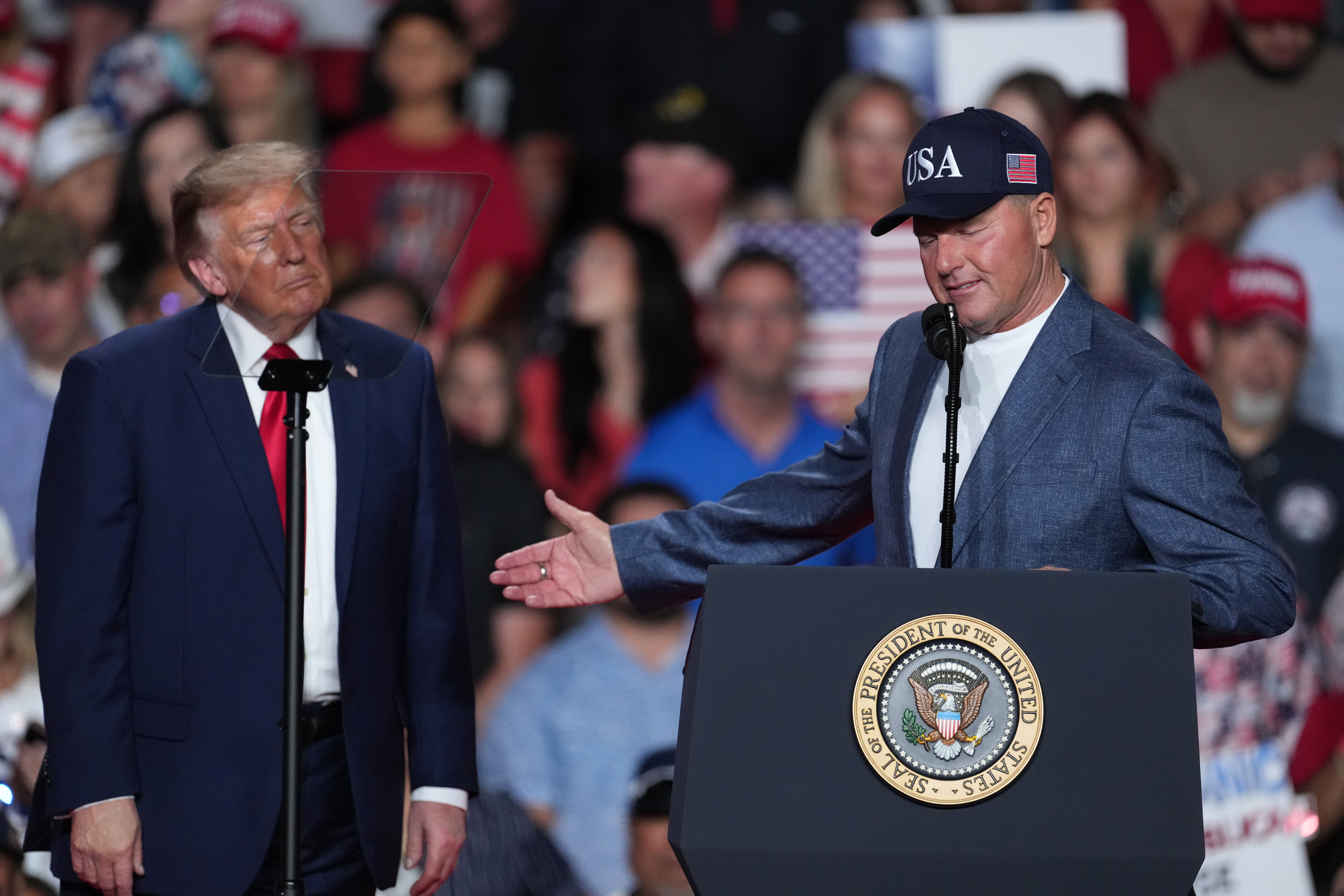 President Donald Trump listens as Roger Clemens speaks at a campaign rally at the Freeman Coliseum in San Antonio, Wednesday, Oct. 7, 2026. 