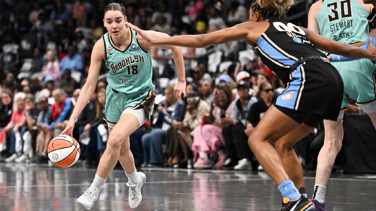 New York guard Pauline Astier (18) drives to the basket against Atlanta forward Naz Hillmon (00) during the first half in Game 2 of the WNBA basketball semifinals, Wednesday, Oct. 7, 2026, in Atlanta.
