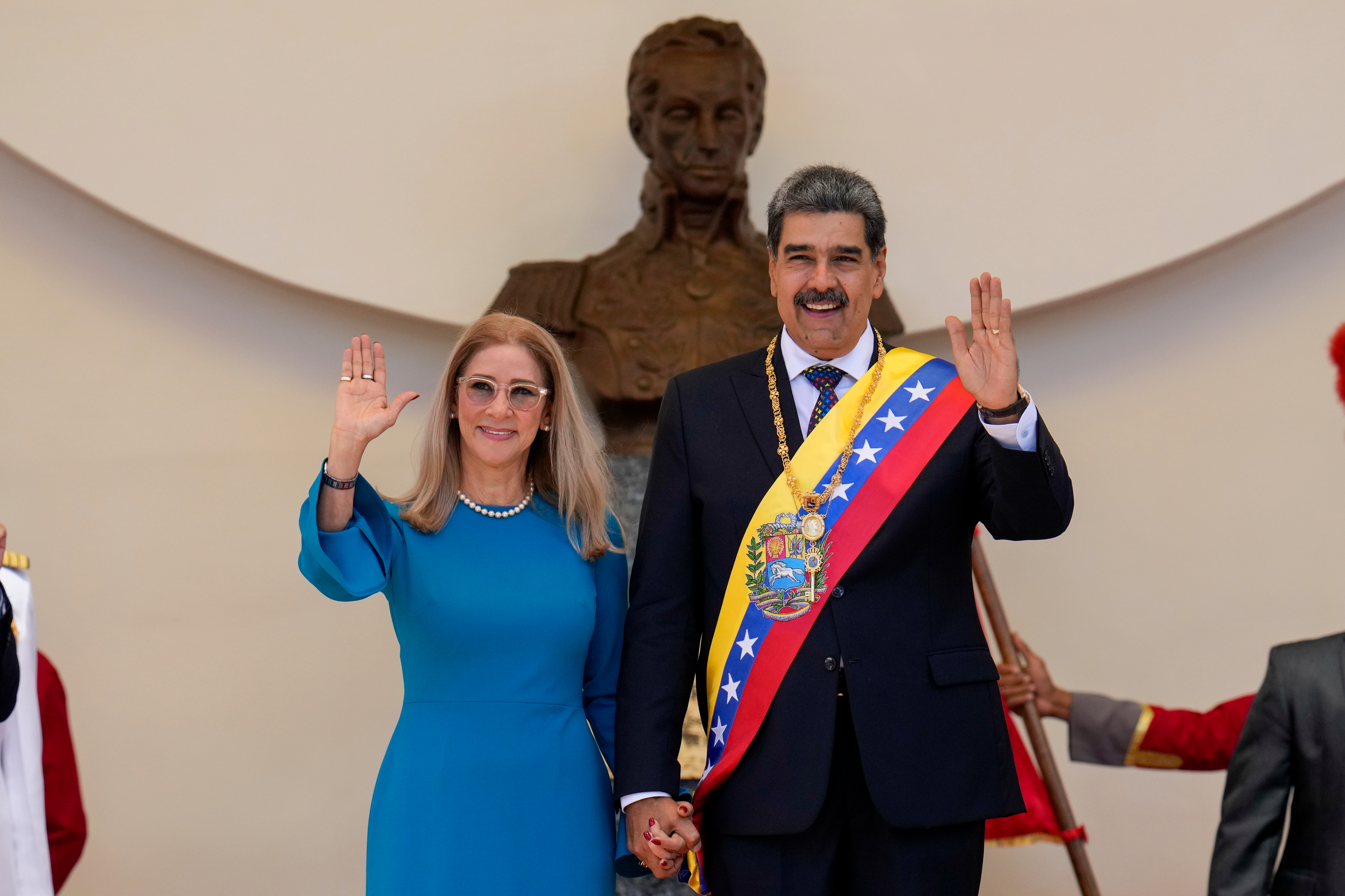 Then-Venezuelan President Nicolas Maduro and his wife, Cilia Flores, wave after his swearing-in ceremony for a third term at the National Assembly in Caracas, Venezuela, on Jan. 10, 2025. Flores is lobbying for her release from prison on health grounds.