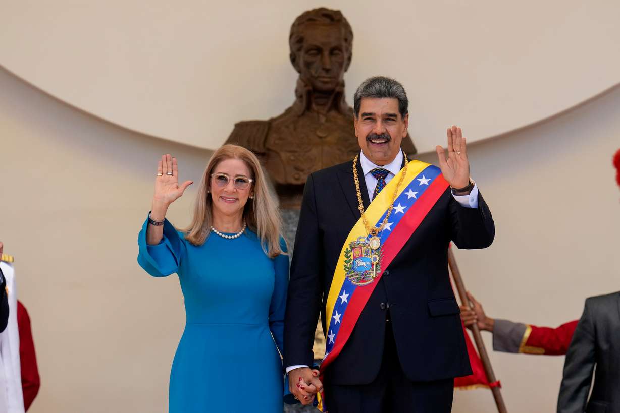 Then-Venezuelan President Nicolas Maduro and his wife, Cilia Flores, wave after his swearing-in ceremony for a third term at the National Assembly in Caracas, Venezuela, on Jan. 10, 2025. Flores is lobbying for her release from prison on health grounds.
