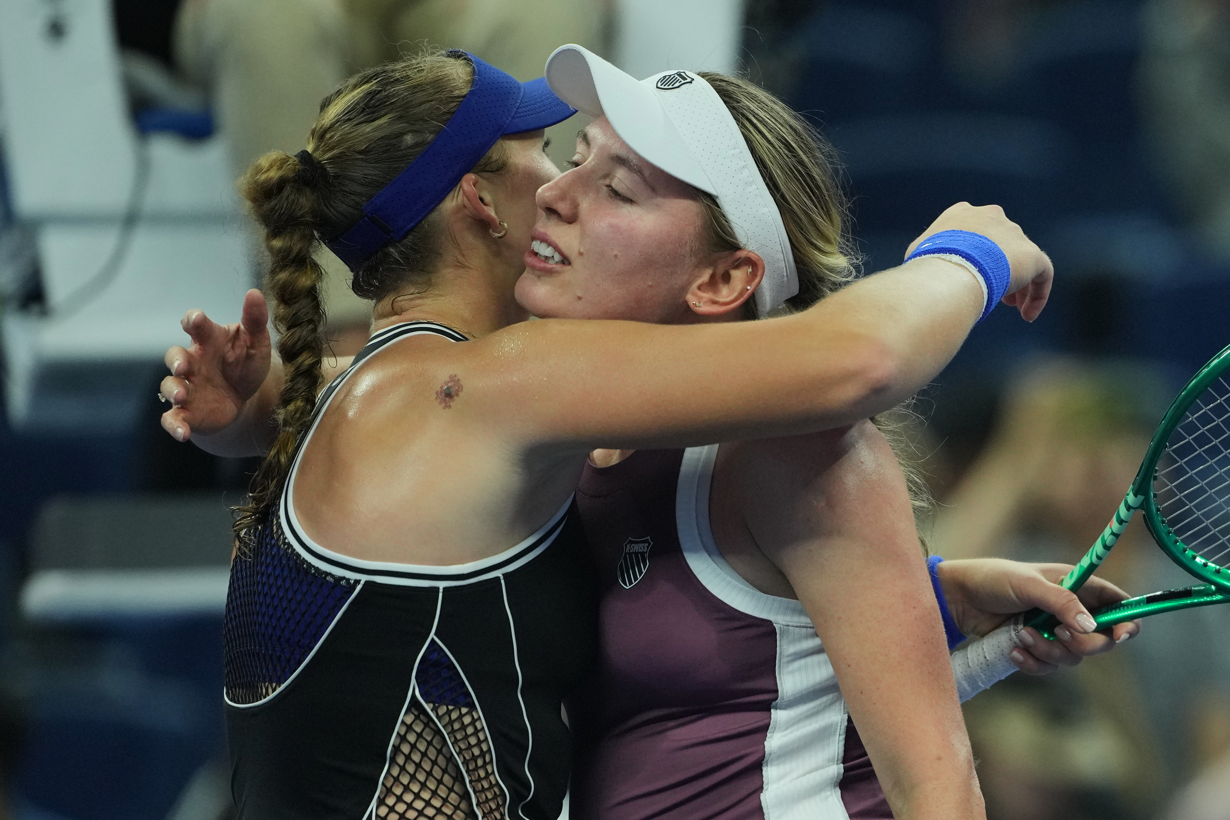 Mirra Andreeva, of Russia, left, hugs Ekaterina Alexandrova, of Russia after winning the quarterfinals of the women's singles match at the China Open tennis tournament in Beijing, Thursday, Oct. 8, 2026.