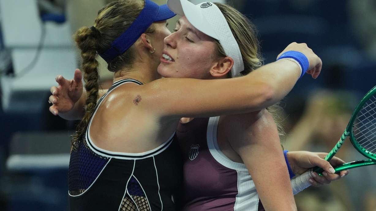 Mirra Andreeva, of Russia, left, hugs Ekaterina Alexandrova, of Russia after winning the quarterfinals of the women's singles match at the China Open tennis tournament in Beijing, Thursday, Oct. 8, 2026.