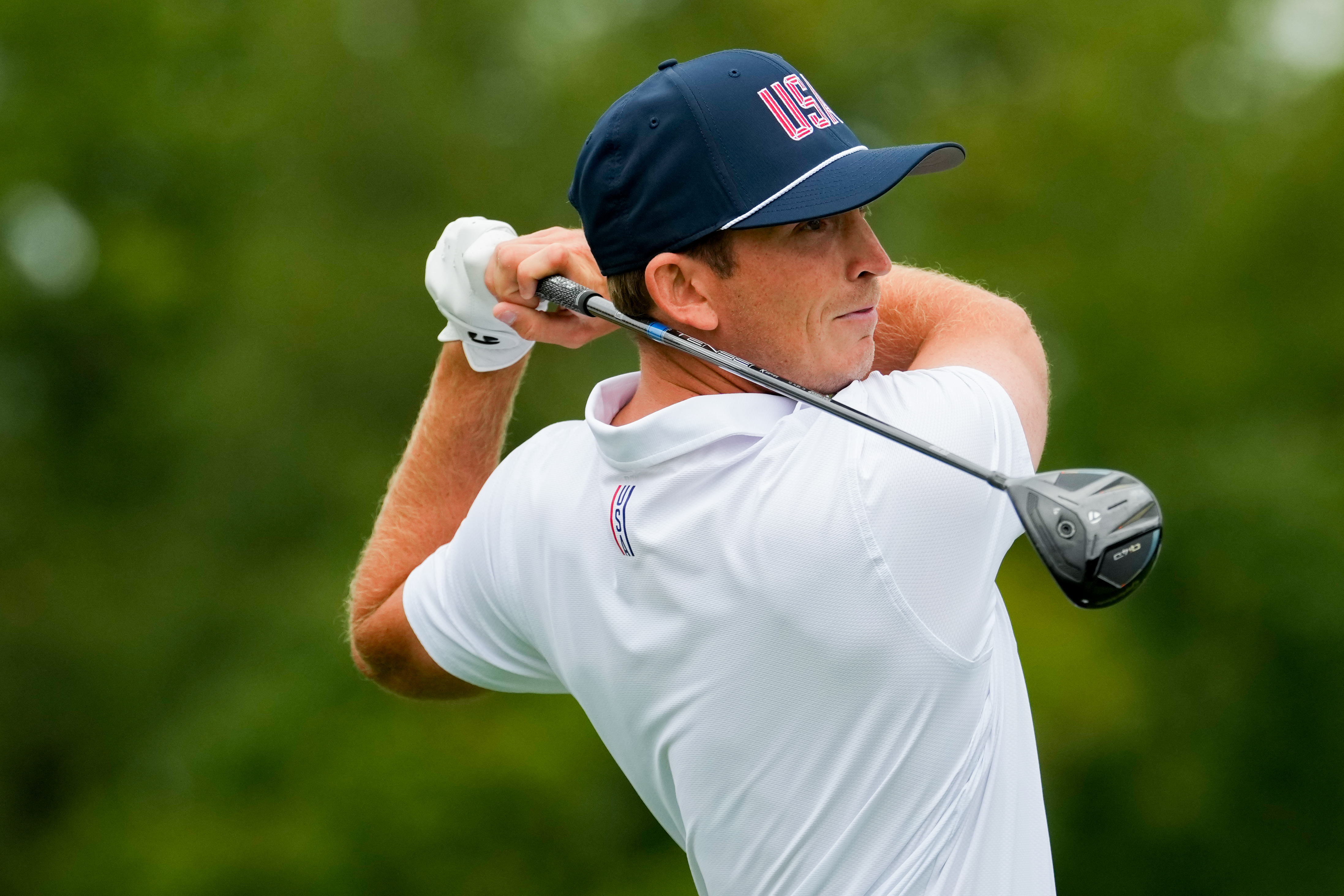USA teams' Jacob Bridgeman hits from the second tee against the International team during the Presidents Cup golf tournament second round foursomes match at Medinah Country Club, Friday, Sept. 25, 2026, in Medinah, Ill. 