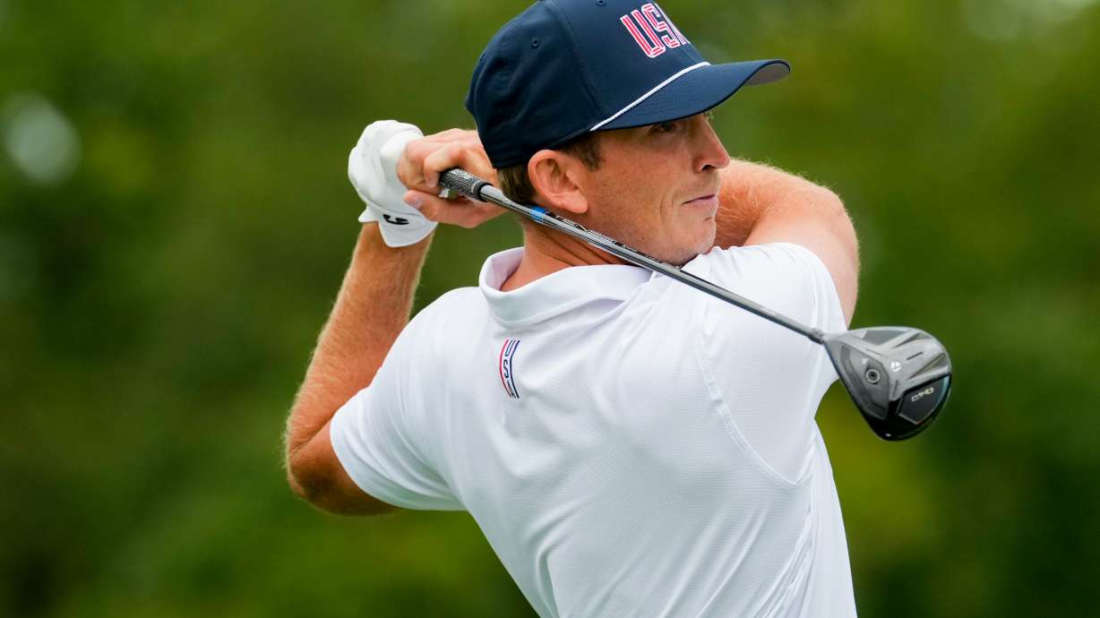 USA teams' Jacob Bridgeman hits from the second tee against the International team during the Presidents Cup golf tournament second round foursomes match at Medinah Country Club, Friday, Sept. 25, 2026, in Medinah, Ill.