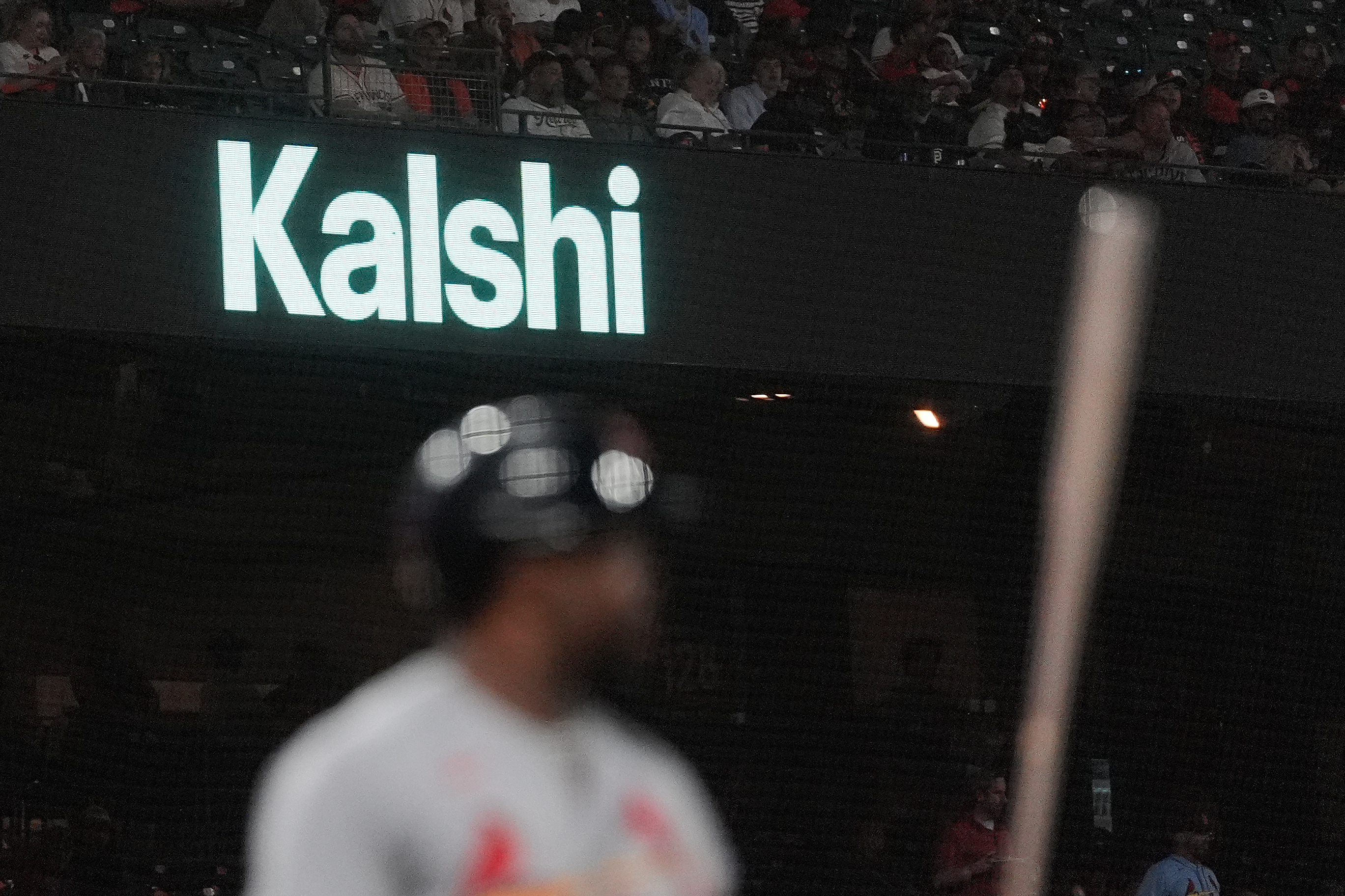 FILE - A Kalshi advertisement is displayed at Oracle Park during a baseball game between the San Francisco Giants and the St. Louis Cardinals, Tuesday, Sept. 8, 2026, in San Francisco. 