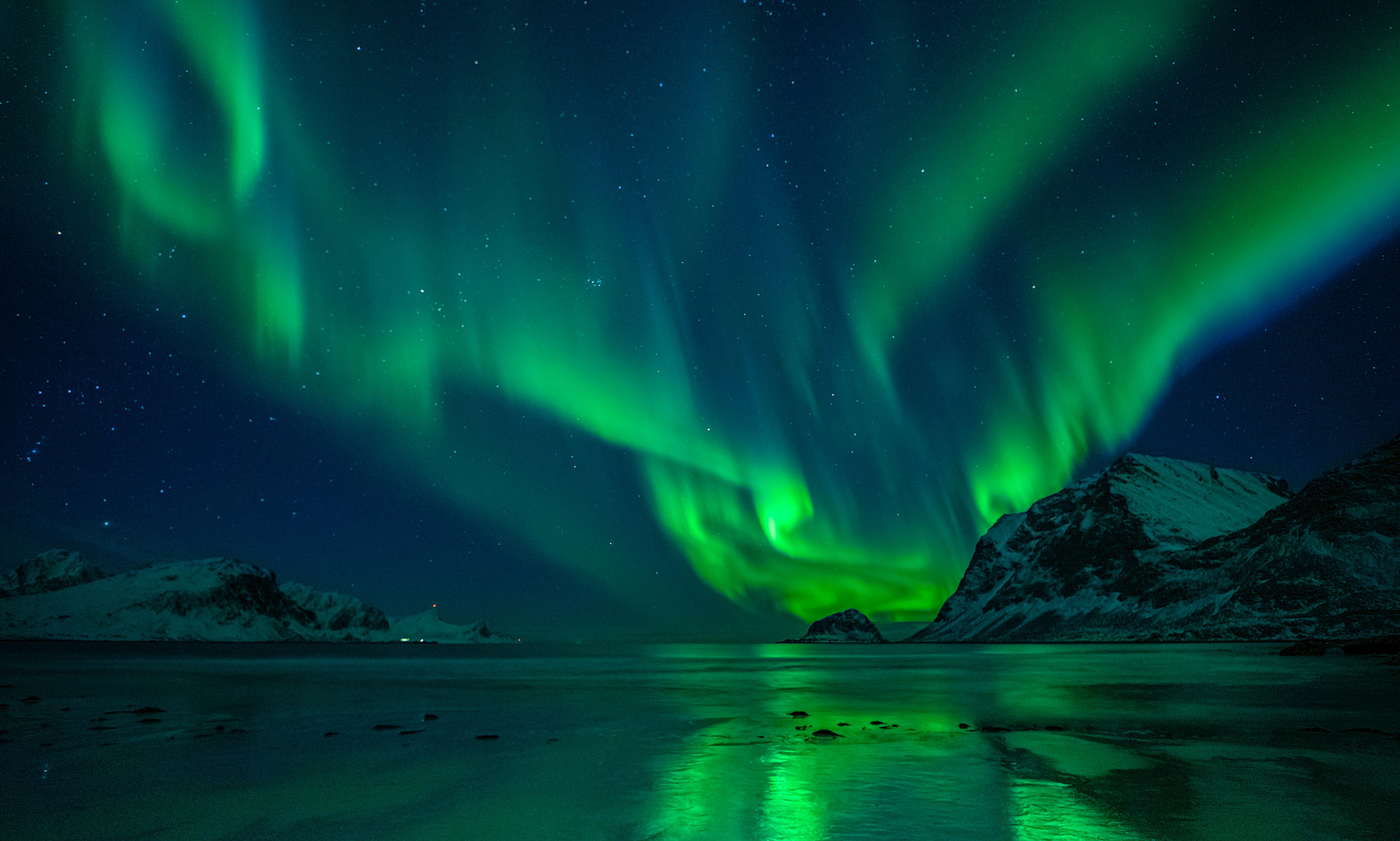 The northern lights from a beach in Iceland.