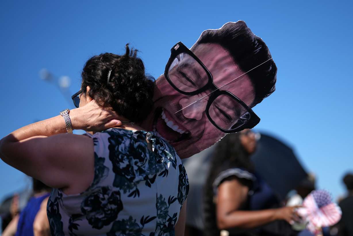 Ofelia Woodruff waits to greet her son, sailor Michael Woodruff, as the USS Abraham Lincoln aircraft carrier returns to Naval Air Station North Island after its record-long deployment, Thursday, in Coronado, Calif.