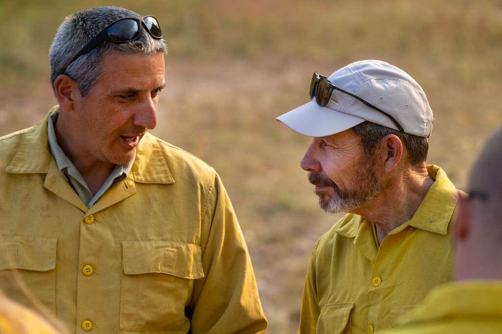 Jason Kling, district ganger for the Forest Service in the Fishlake National Forest, talks with Utah Sen. John Curtis (right) as the senator makes a stop to observe as fireighters from the U.S. Forest Service conduct a prescribed burn in the mountains around Kinneys Peak and south of I-70 on Wednesday.