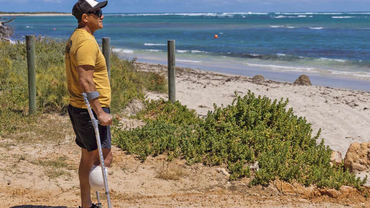 Shark attack survivor Mel Ismail looks out at Glenfield Beach near Geraldton, Australia, on Oct. 7, 2026.
