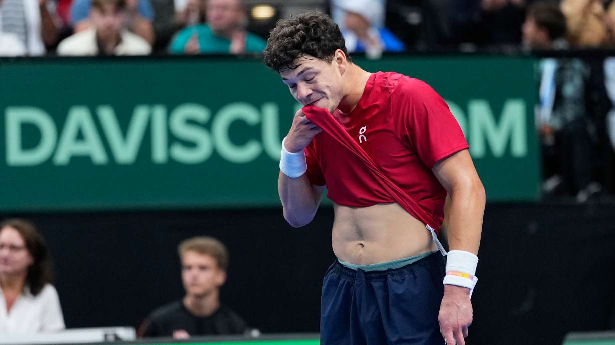 United States' Ben Shelton wipes his face after a point against Czechia's Jakub Mensik during the Davis Cup second round qualifier match between the Czech Republic and the United States, in Prague, Saturday, Sept. 19, 2026.