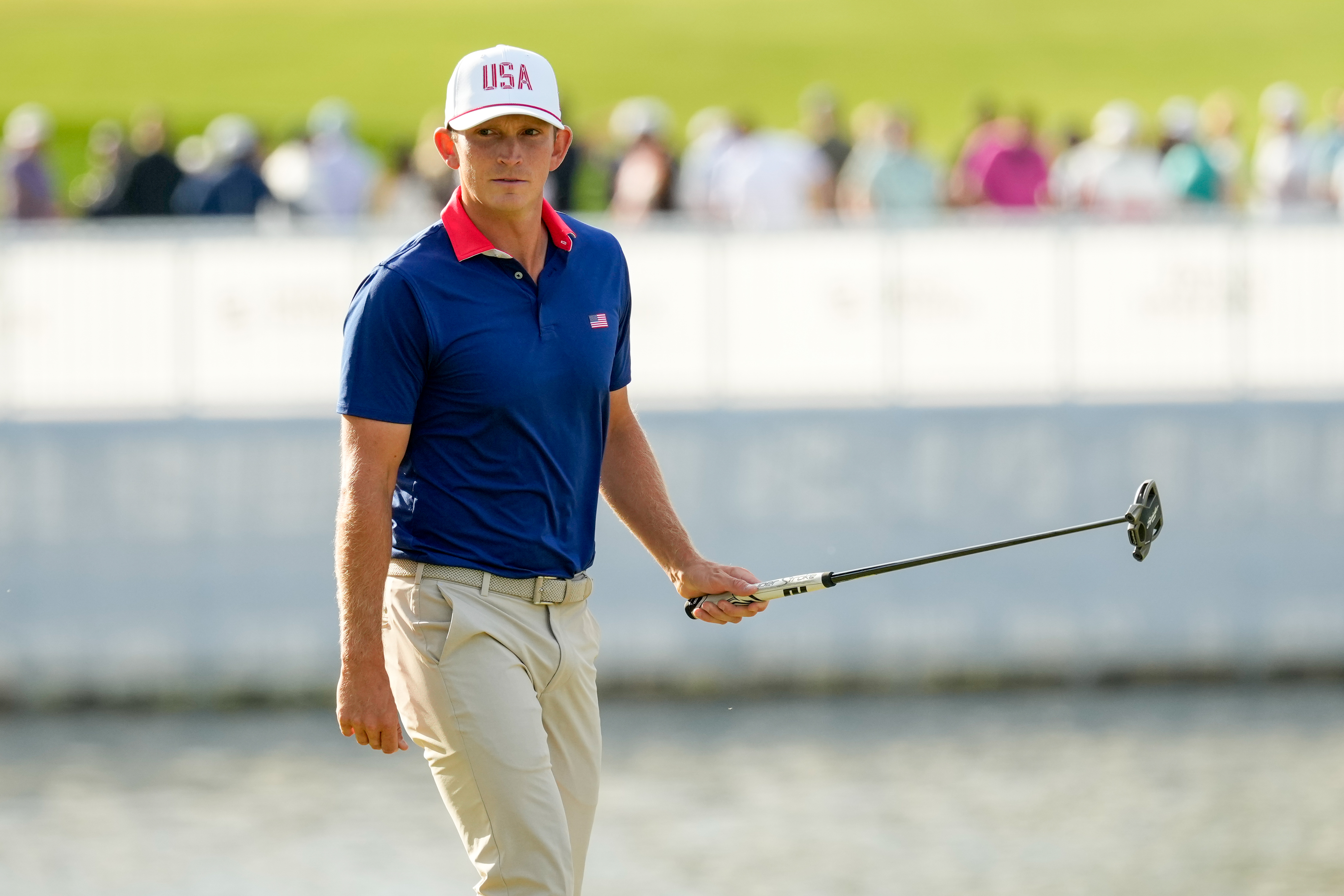 USA teams' Jacob Bridgeman watches his shot on the 13th green against the International team during a Presidents Cup golf tournament third round foursome match at Medinah Country Club, Saturday, Sept. 26, 2026, in Medinah, Ill. 