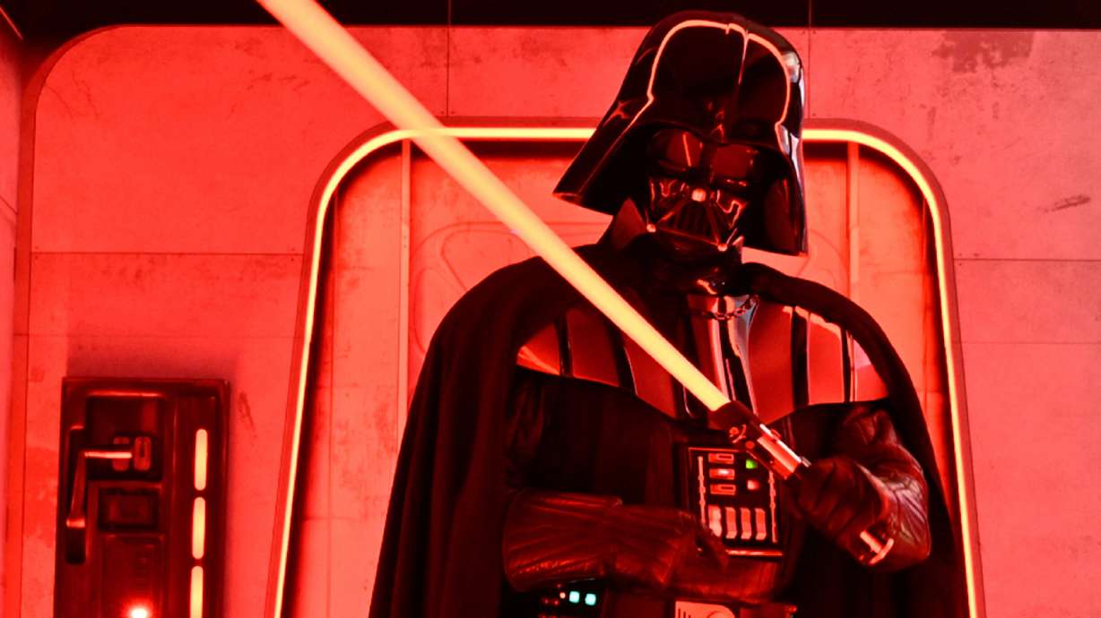 A Darth Vader costumed character poses at the Hasbro and Amazon Star Wars interactive Imperial March experience at the Empire State Building on March 21, 2024, in New York.