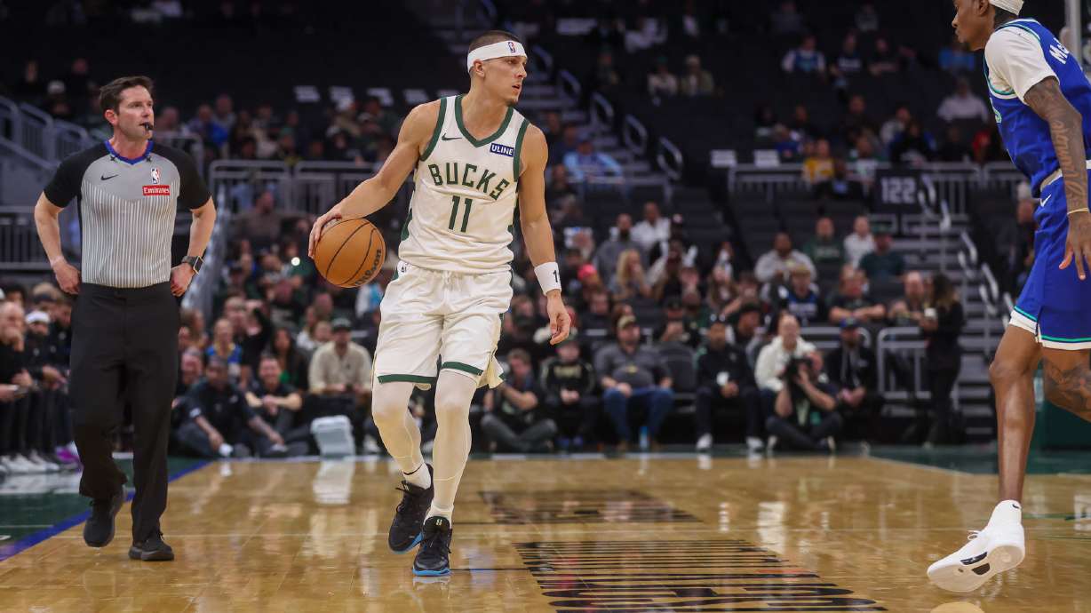 Milwaukee Bucks' guard Tyler Herro, left, brings the ball up the court against Minnesota Timberwolves forward Jaden McDaniels', right, during a preseason NBA basketball game Monday, Oct. 5, 2026, in Milwaukee.