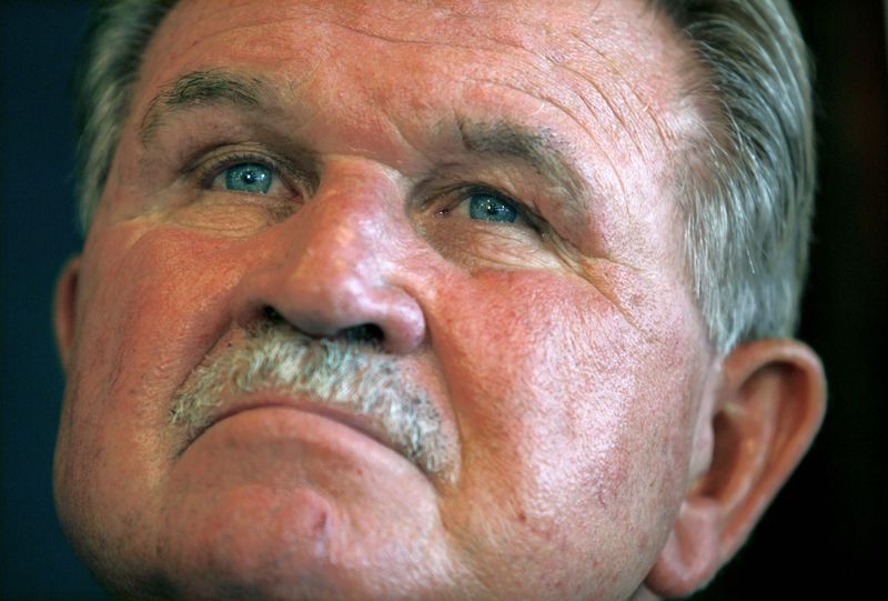 FILE PHOTO: Former NFL player and head coach Mike Ditka listens to fellow former players speak at a news conference held by the Gridiron Greats Assistance Fund at the National Press Club in Washington June 26, 2007.