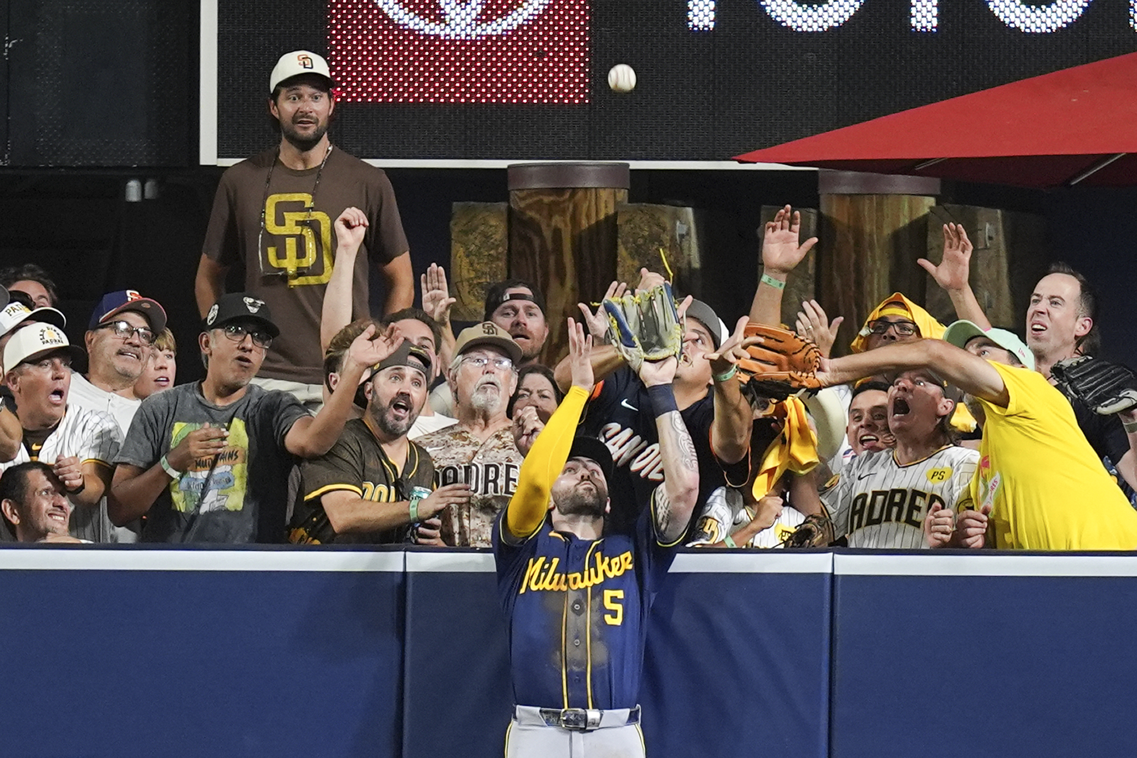 Milwaukee Brewers center fielder Garrett Mitchell catches a ball hit by San Diego Padres' Manny Machado during the eighth inning in Game 4 of baseball's National League Division Series Wednesday, Oct. 7, 2026, in San Diego. 