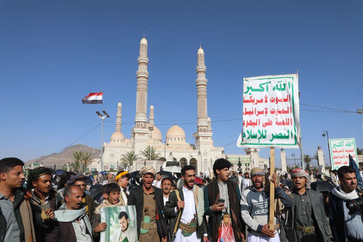Supporters of Yemen's Houthi rebels shout slogans during a rally in support of the group, in Sanaa, Yemen, Friday. The Houthis had earlier warned of disruptions to flights operating in the area of their strikes in Saudi Arabia.