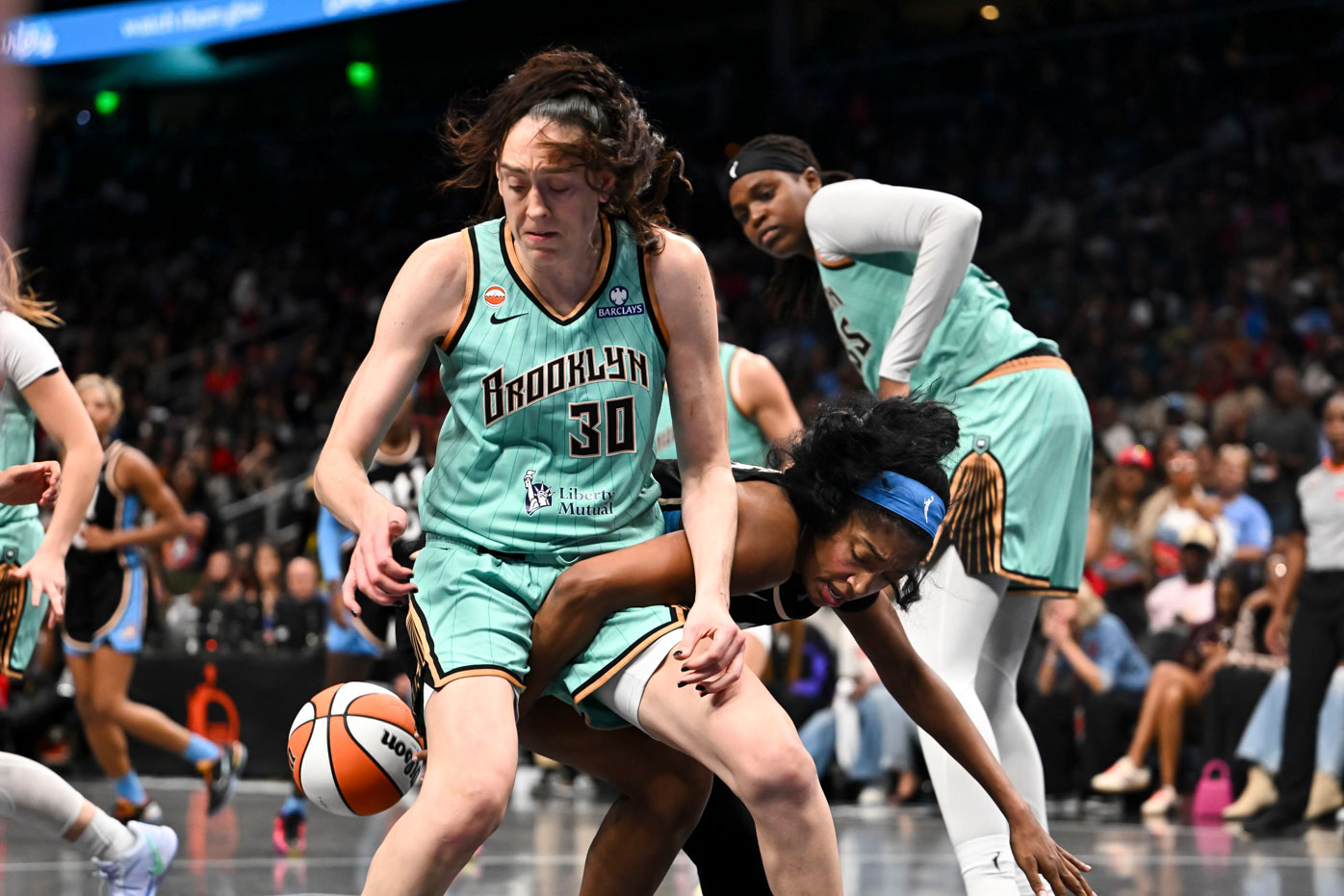 Atlanta Dream forward Angel Reese (5) and New York Liberty forward Breanna Stewart (30) fight for a rebound during the second half in Game 2 of the WNBA basketball semifinals, Wednesday, Oct. 7, 2026, in Atlanta. 