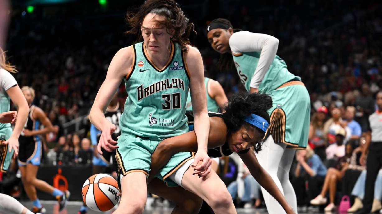 Atlanta Dream forward Angel Reese (5) and New York Liberty forward Breanna Stewart (30) fight for a rebound during the second half in Game 2 of the WNBA basketball semifinals, Wednesday, Oct. 7, 2026, in Atlanta.
