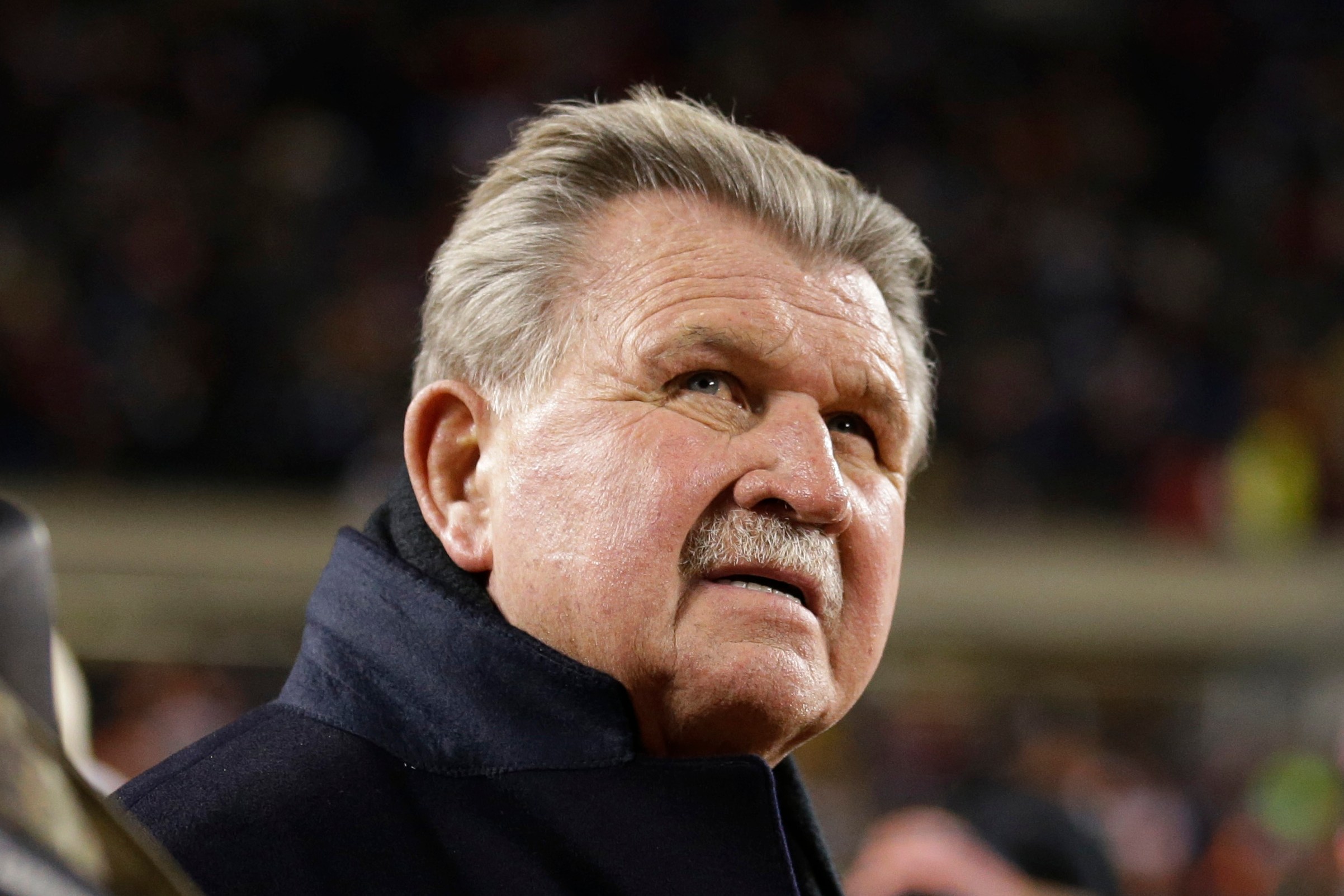 FILE - Former Chicago Bears player and football coach Mike Ditka waits for the halftime ceremony where his No. 89 was to be retired by the Bears during an NFL football game between the Bears and the Dallas Cowboys, Monday, Dec. 9, 2013, in Chicago. 
