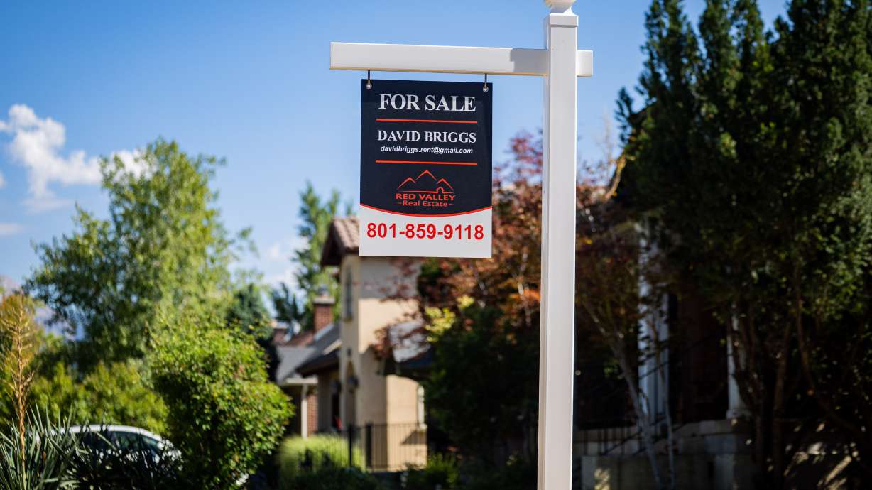 A “for sale” sign in the Yalecrest neighborhood in Salt Lake City on July 23. Fewer Americans are seeking to borrow money to buy homes as mortgage rates continue to climb.