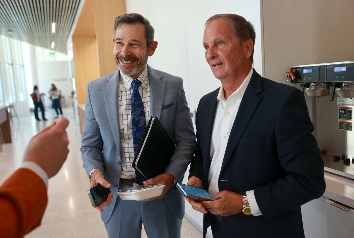 Sen. John Curtis, R-Utah, and former Rep. Chris Stewart, R-Utah, talk at the University of Utah’s Eccles School of Medicine building in Salt Lake City on Friday.