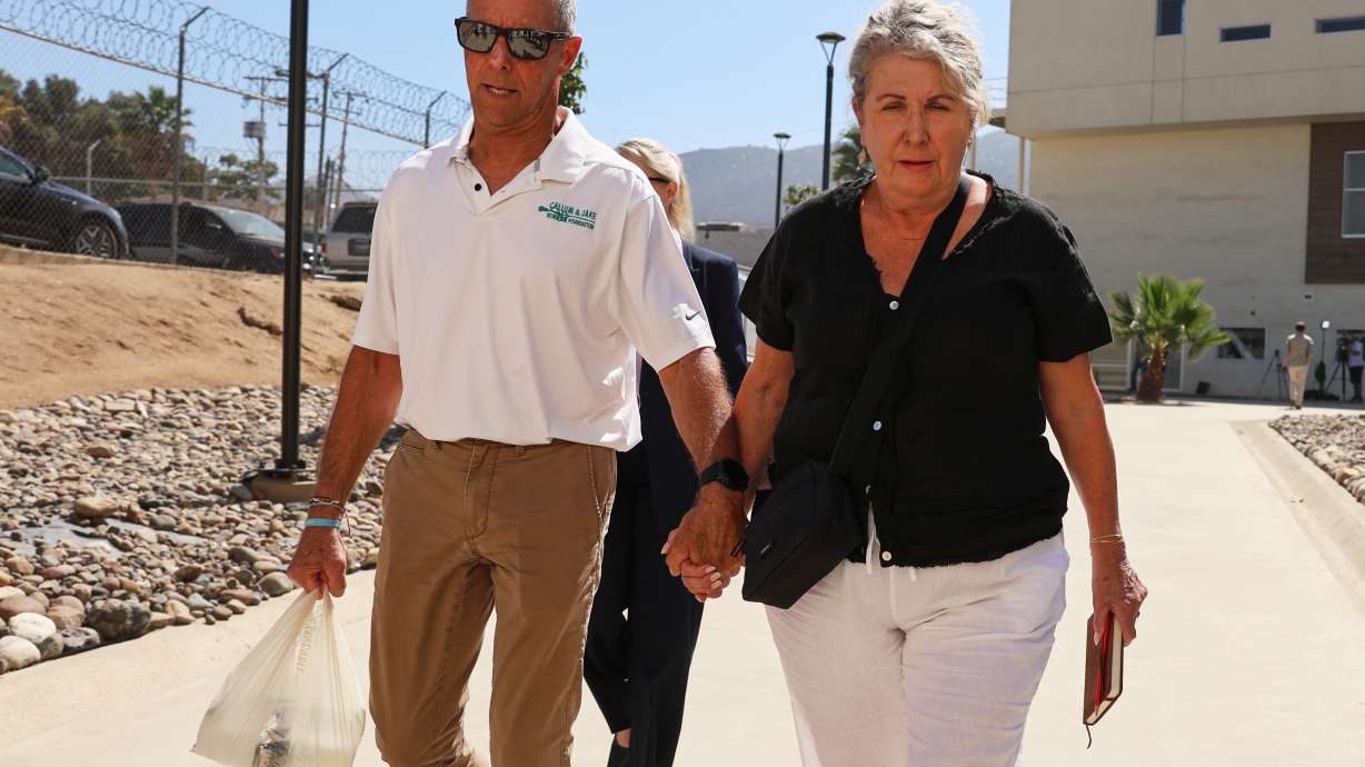 Debra and Martin Robinson, the parents of Australian brothers Callum and Jake Robinson, arrive to court for the trial of the men accused of murdering them, in Ensenada, Mexico, Thursday, Oct. 8, 2026.