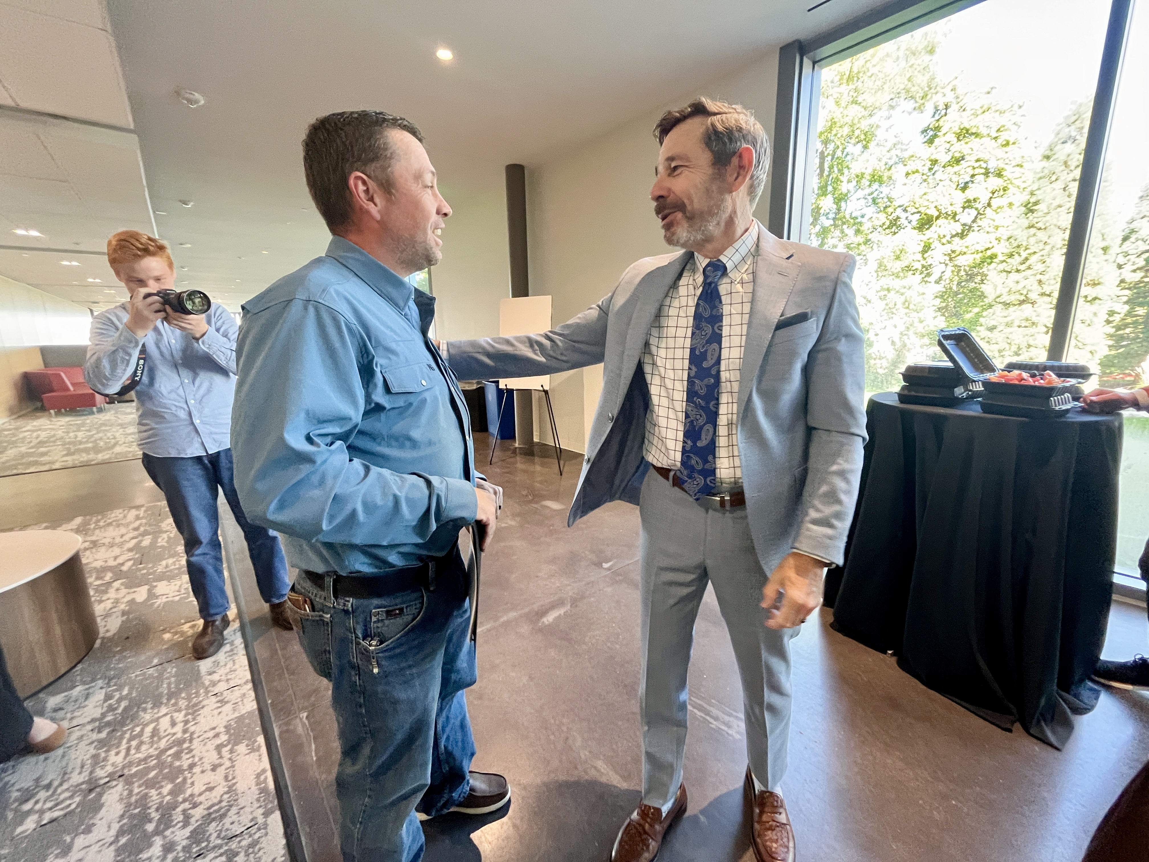 Utah Sen. John Curtis, right, speaks with  House Majority Leader Casey Snider, R-Paradise, after the Western Wildfire Resilience Roundtable at the University of Utah on Friday.