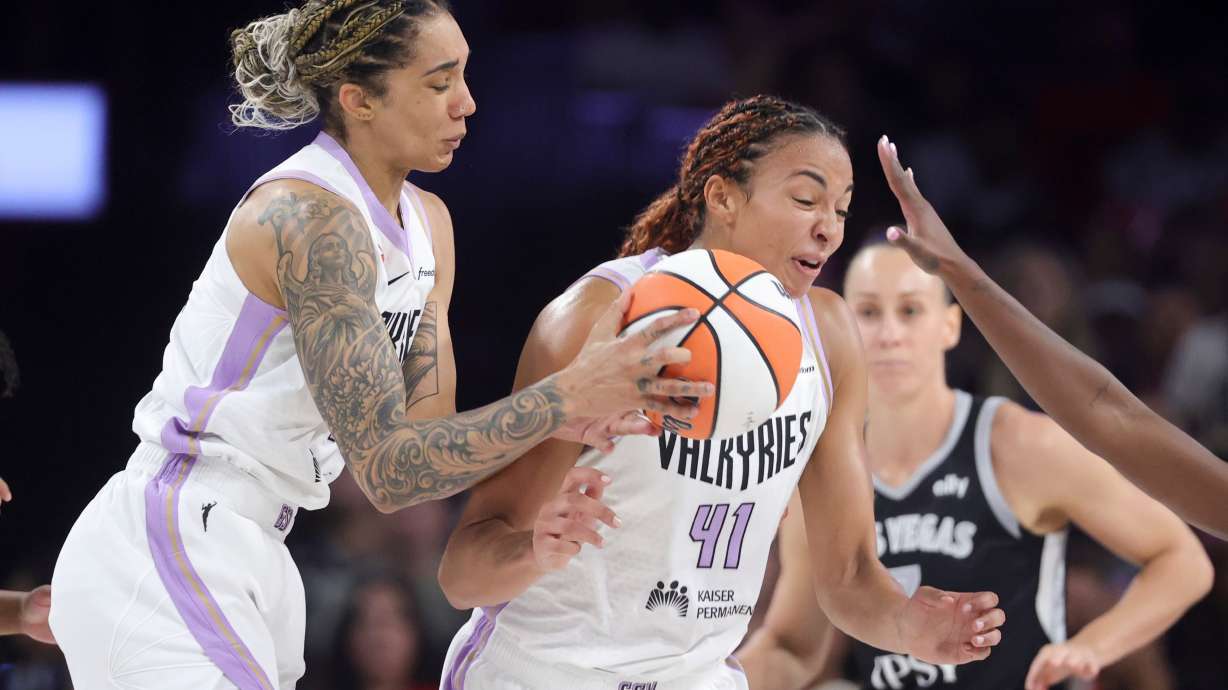 Golden State Valkyries forward Gabby Williams, left, and center Kiah Stokes (41) collide while going for the ball against the Las Vegas Aces during the first half of Game 3 of the WNBA basketball semifinals Friday, Oct. 9, 2026, in Las Vegas.