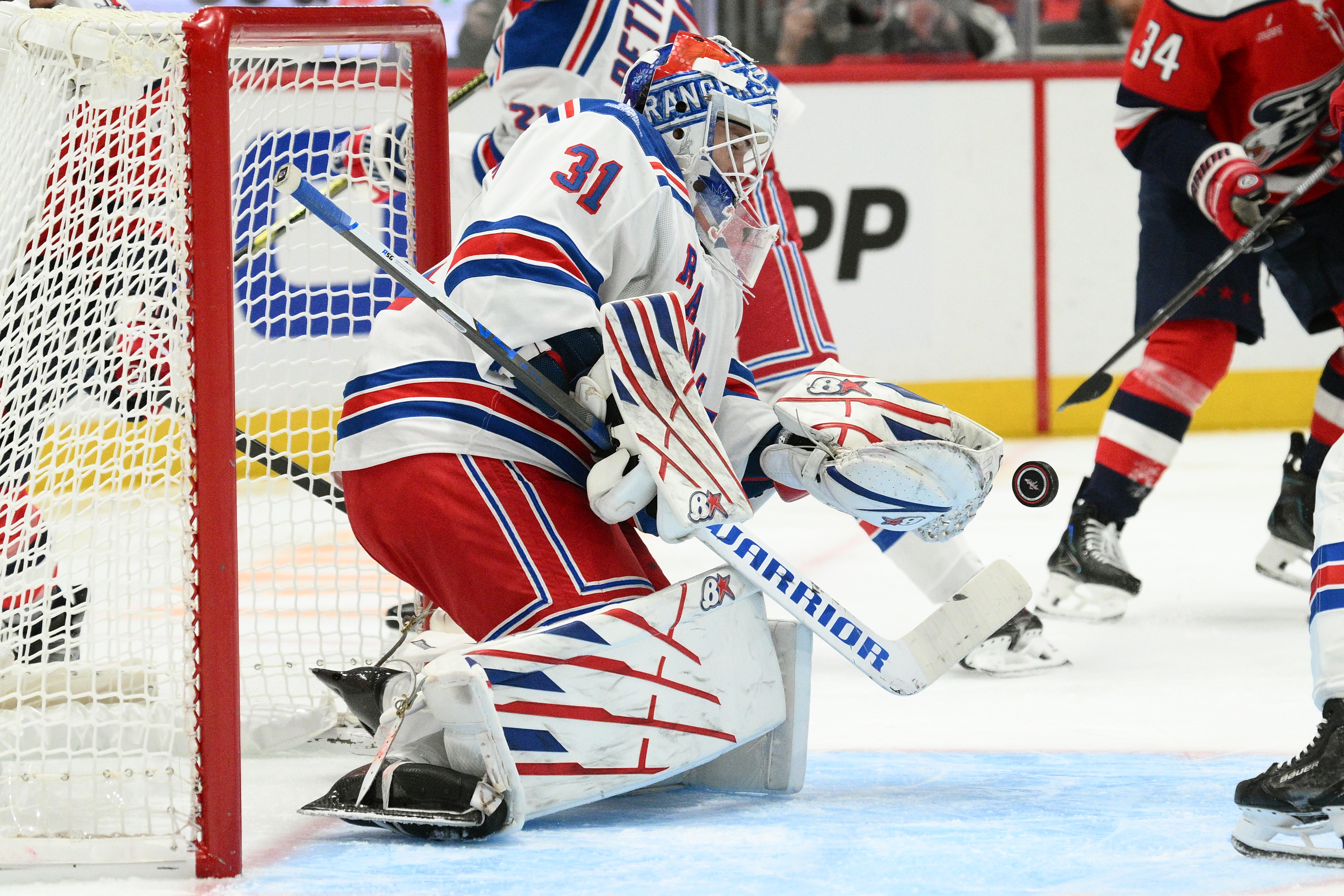 New York Rangers goaltender Igor Shesterkin (31) stops the puck during the first period of an NHL hockey game against the Washington Capitals, Friday, Oct. 9, 2026, in Washington. 
